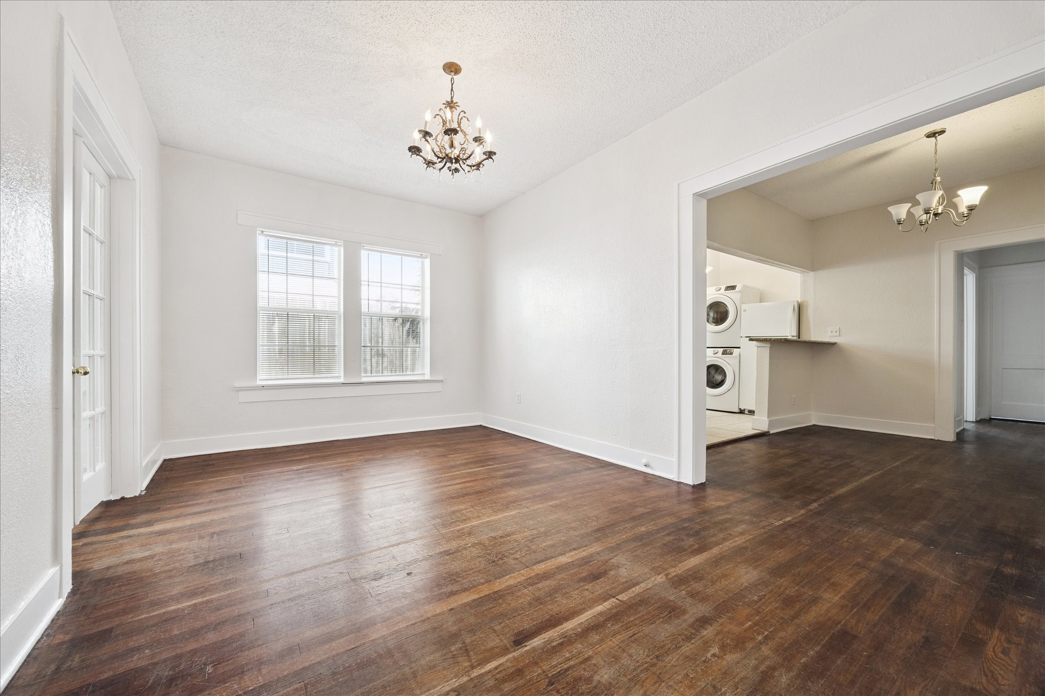 Another view of living room opening up to kitchen and breakfast/dining room.