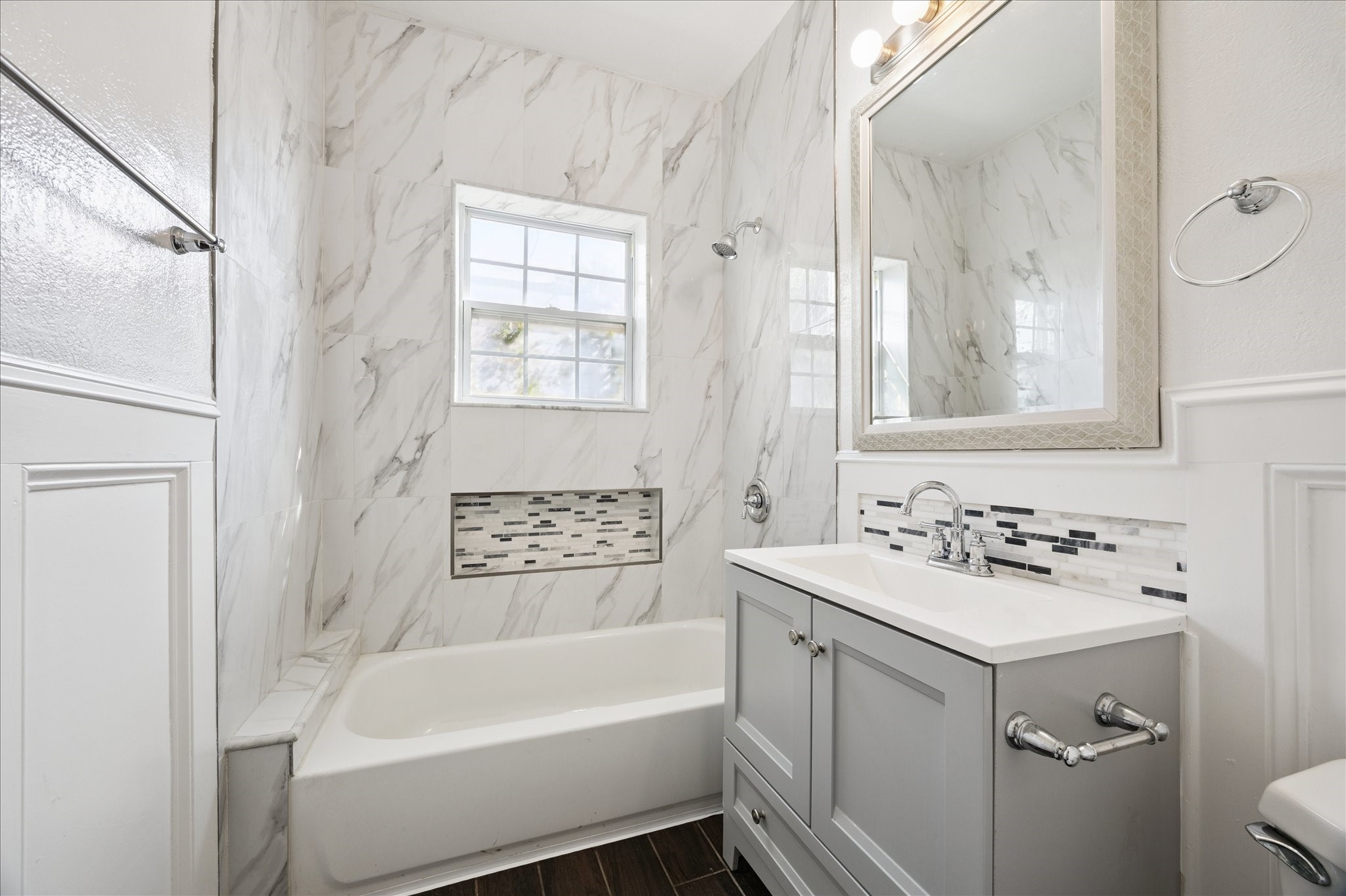 Recently updated bathroom with tub/shower combo. Elegant and functional.