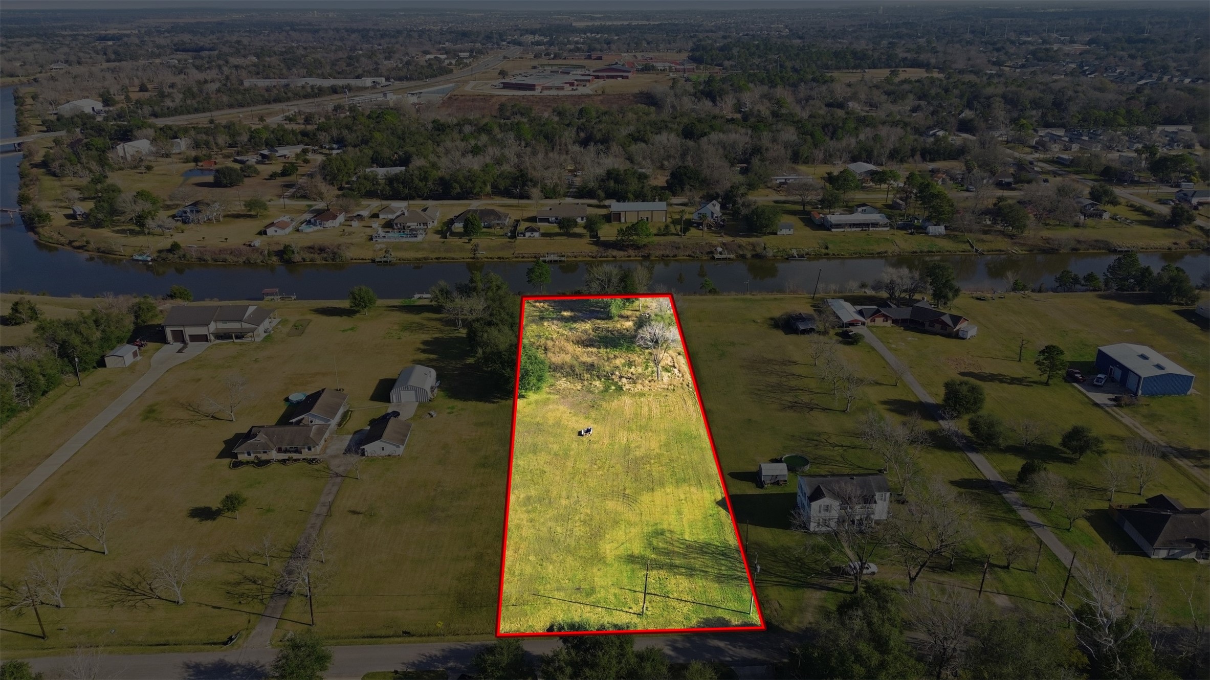 Waterfront acreage with public utilities.