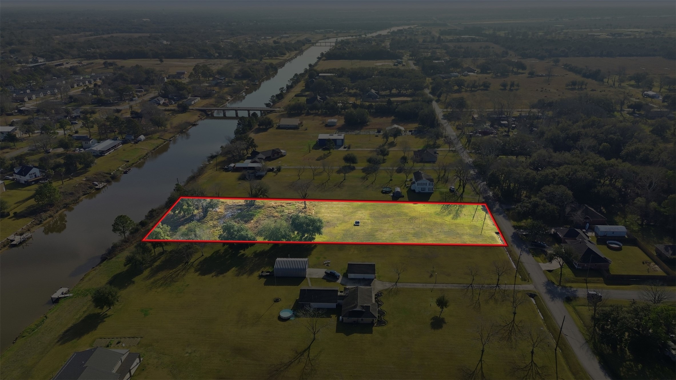 Beautiful acreage homesite with waterfront.