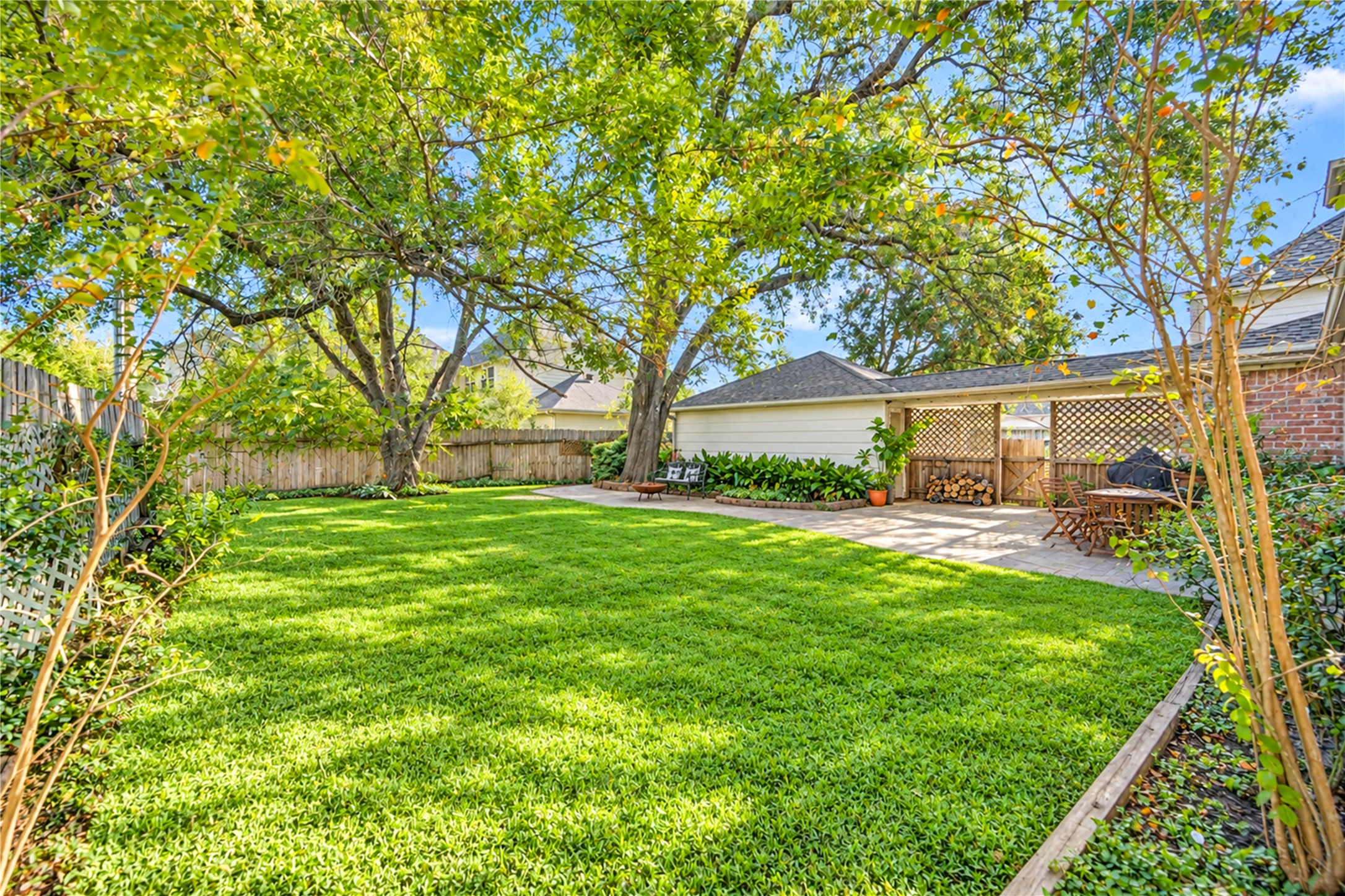 Room to roam, relax and enjoy the outdoors! This expansive backyard is a rare find, featuring a lush green lawn, beautiful mature shade trees and plenty of open space for outdoor activities. Imagine weekend lawn games, gardening, or simply relaxing beneath the trees with a favorite book. Fully fenced and surrounded by established greenery, this peaceful backyard offers a wonderful blend of privacy, natural beauty and endless possibilities for outdoor living!