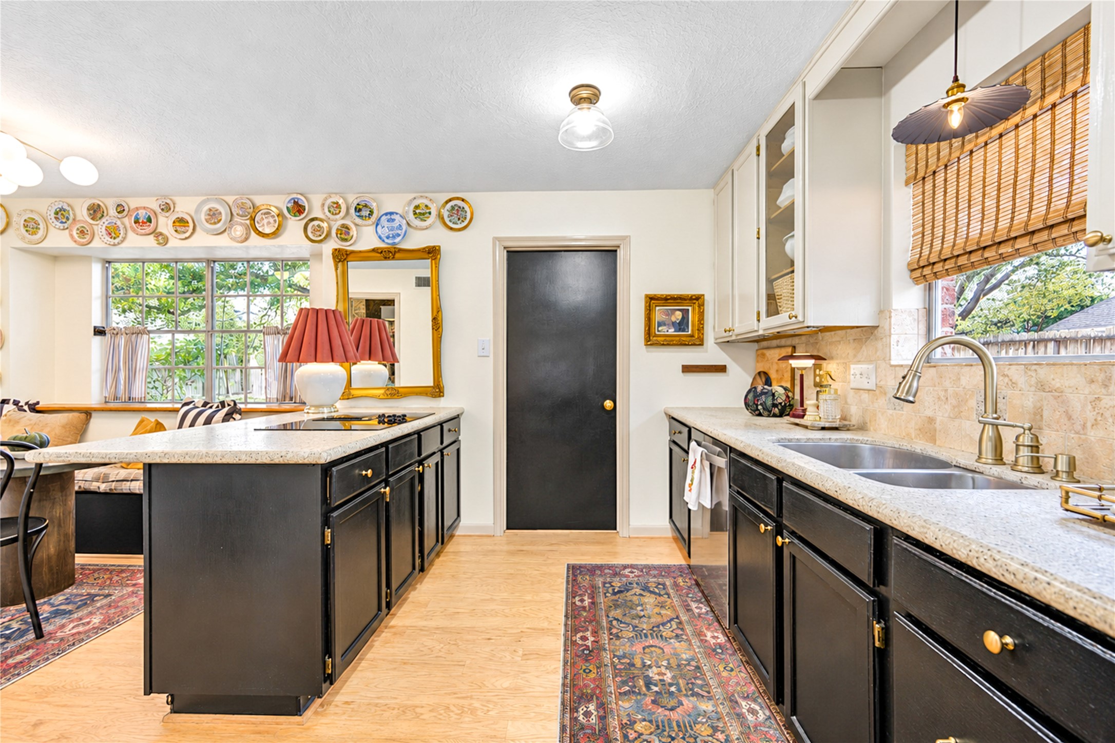 The heart of the home! This beautifully appointed kitchen blends timeless charm with everyday functionality, featuring rich cabinetry, granite countertops, a travertine backsplash and a spacious center island. Sunlight fills the space, creating the perfect setting for morning coffee, preparing favorite recipes or gathering with friends and family. The heart of the home! This beautifully appointed kitchen blends timeless charm with everyday functionality, featuring rich cabinetry, granite countertops, a travertine backsplash and a spacious center island. Sunlight fills the space, creating the perfect setting for morning coffee, preparing favorite recipes or gathering with friends and family.