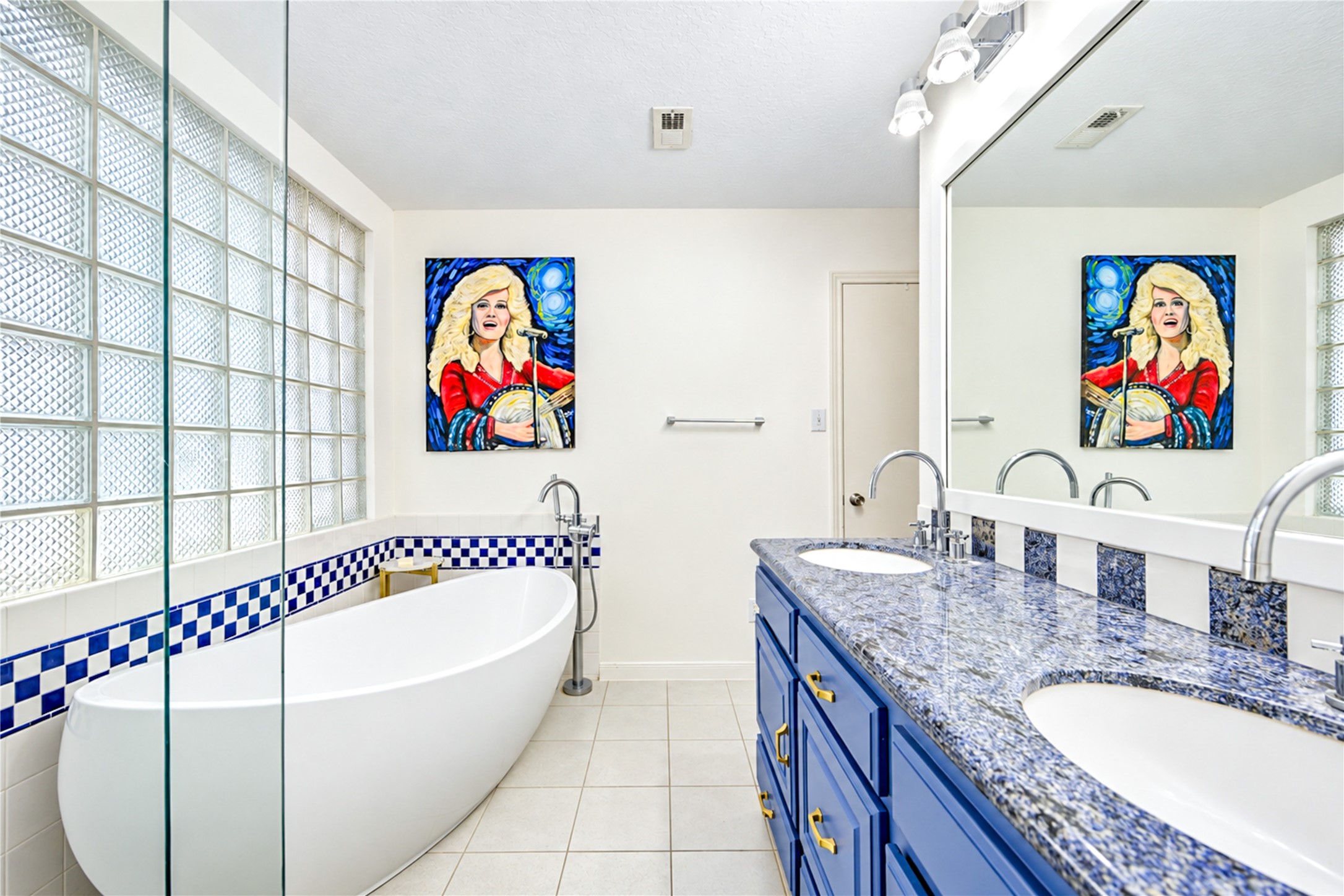 Your own spa-inspired escape! The beautifully renovated second-floor primary ensuite bath offers a refreshing blend of modern elegance and designer style. Unwind in the freestanding soaking tub, enjoy the separate walk-in shower and appreciate the striking blue vanity, sleek countertops and stylish tile accents. A bright, serene retreat designed to make everyday routines feel like a luxurious getaway!