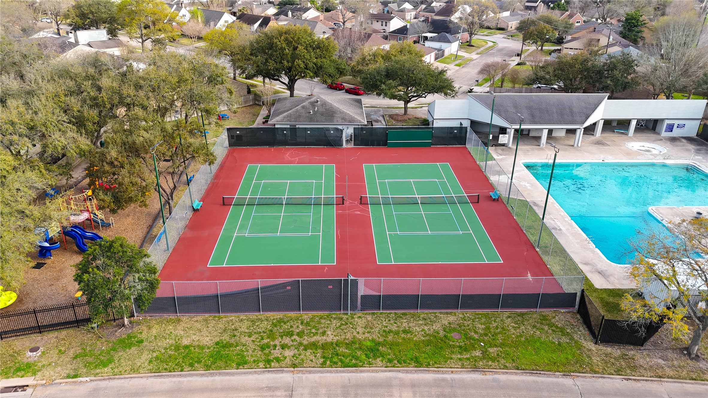 Game, set, match! Enjoy an active lifestyle right in your own Village West community with neighborhood tennis courts and a sparkling swimming pool just steps apart. Whether you're starting the morning with a friendly match, cooling off on a warm Houston afternoon or connecting with neighbors, these inviting recreational amenities make it easy to enjoy the outdoors. Another wonderful perk of living in this established Energy Corridor neighborhood!