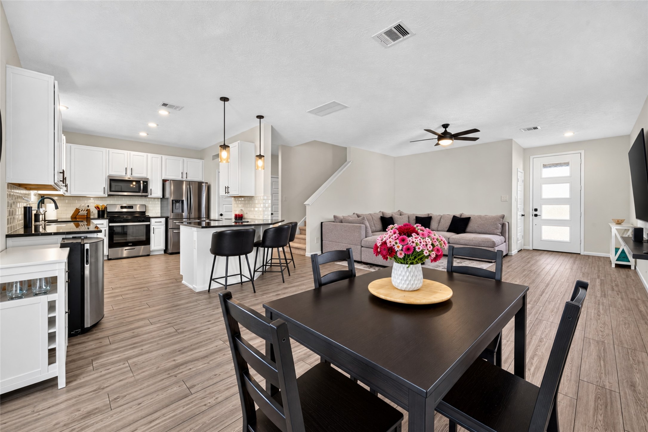 Enjoy the convenience of a dining area that flows seamlessly into the kitchen and living room. Whether hosting dinner or enjoying a quiet meal, this open layout makes every occasion feel connected.