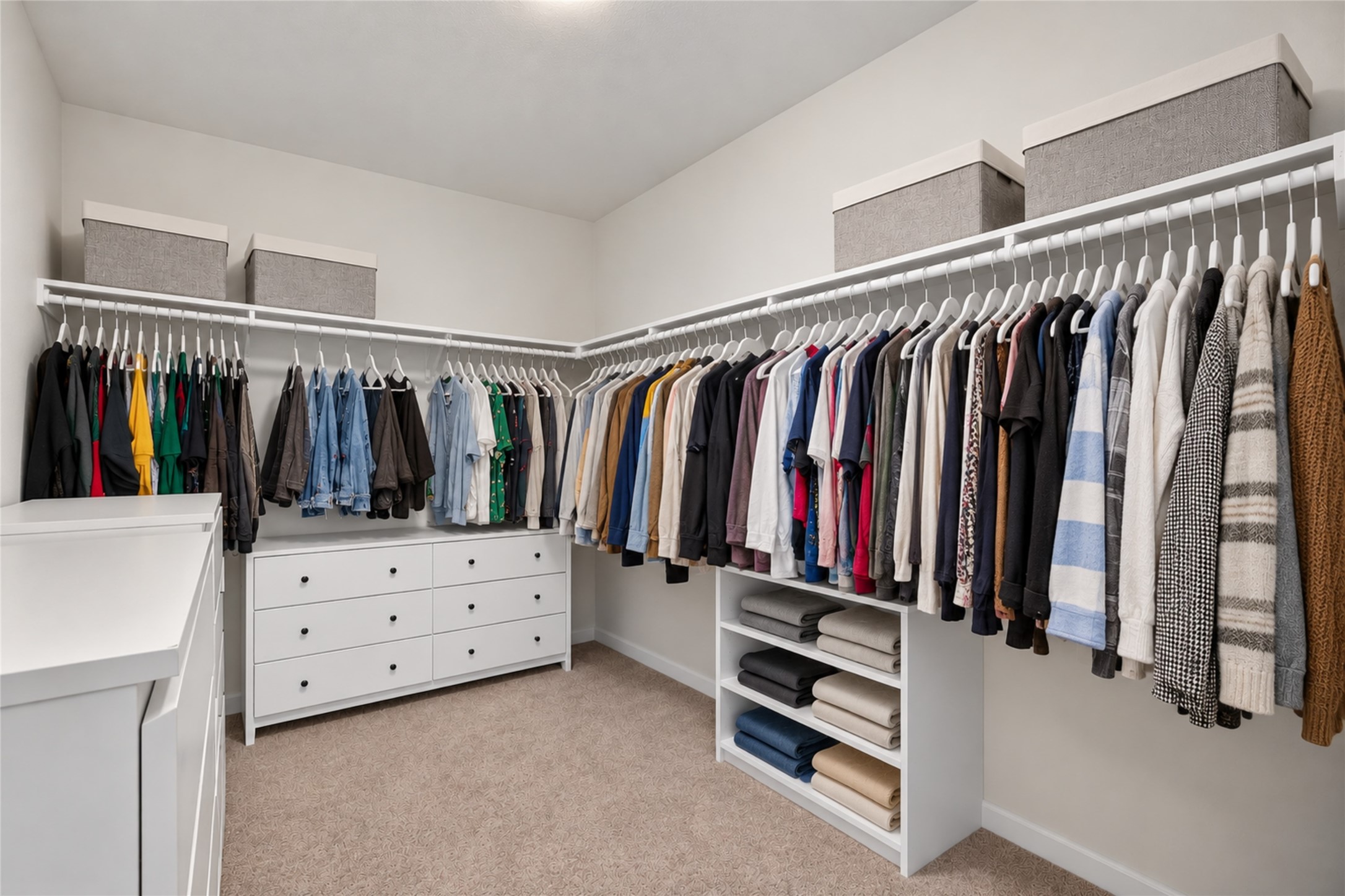 Enjoy the luxury of an expansive walk-in closet with abundant hanging space, shelving, and built-in drawers. Keeping clothing, shoes, and accessories organized is effortless with this thoughtfully arranged storage area.