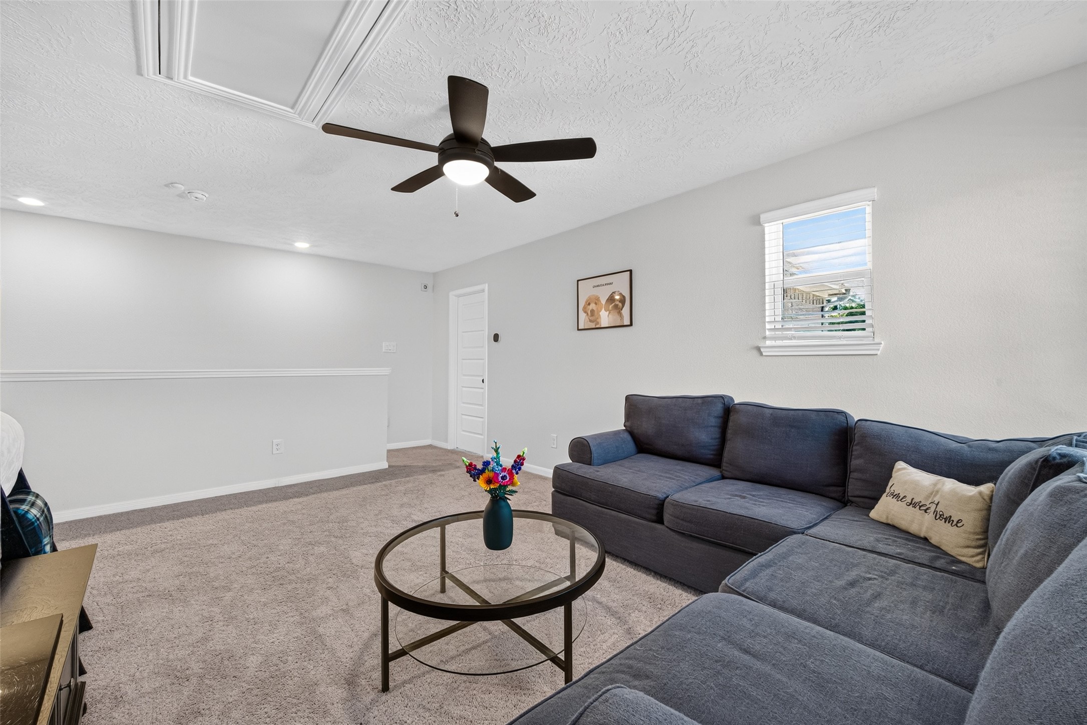 Create the ultimate entertainment retreat in this generously sized upstairs game room. The open layout offers flexibility for comfortable seating, recreational activities, and your favorite pastimes.