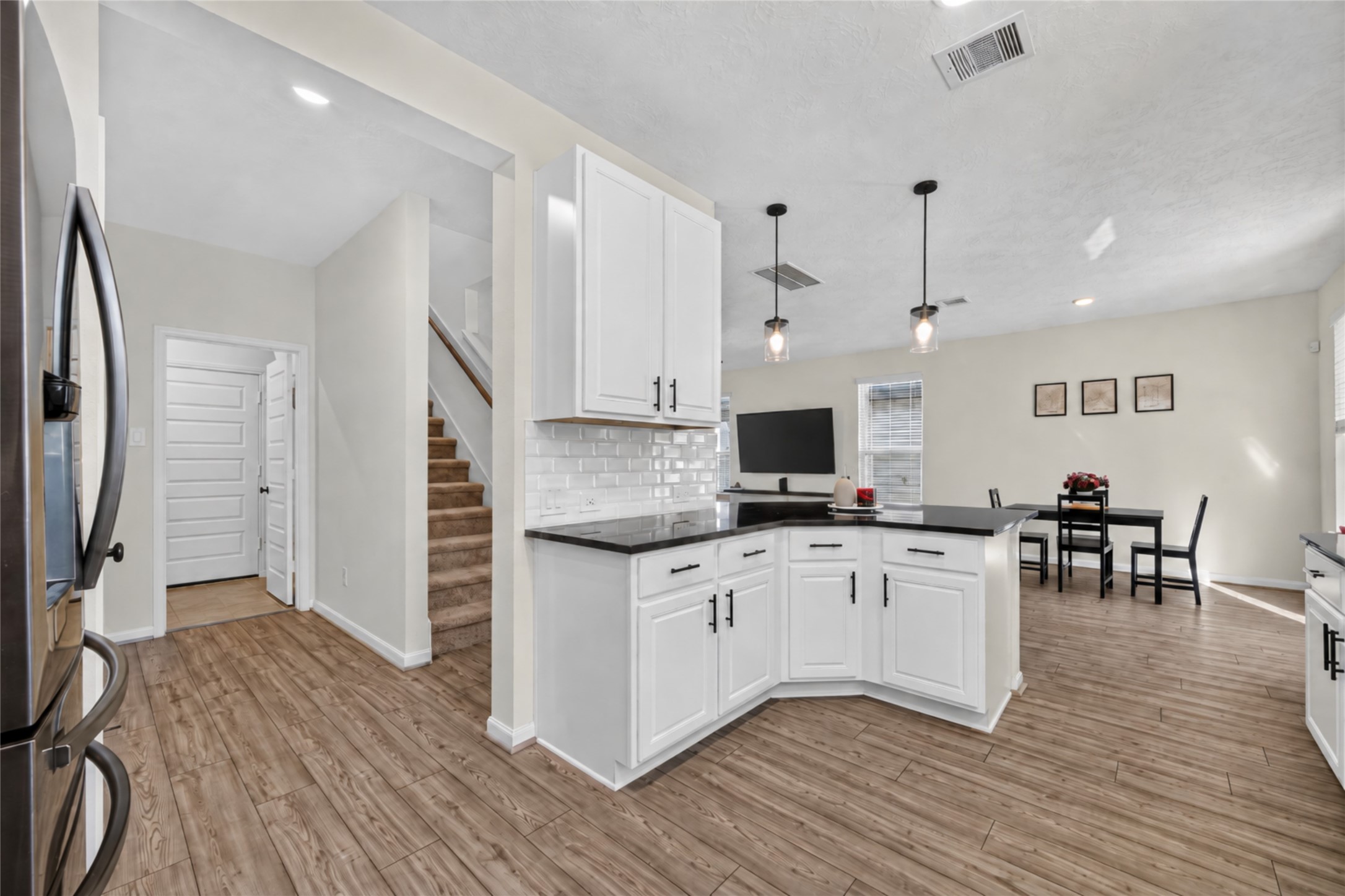 Stay connected to the conversation while preparing meals in this open-concept kitchen. The island overlooks the adjoining living space, creating a natural gathering place for entertaining and everyday activities.