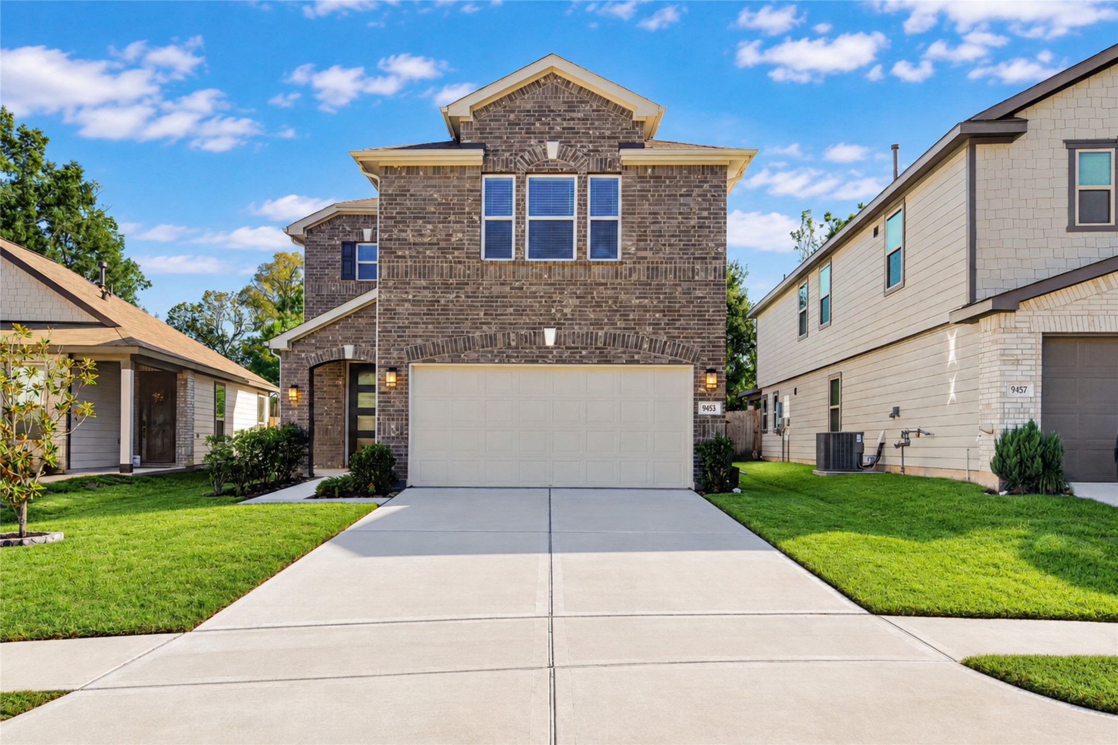 Welcome home to this attractive two-story residence featuring a brick exterior and attached two-car garage. The spacious driveway provides convenient parking while complementing the home's inviting curb appeal.