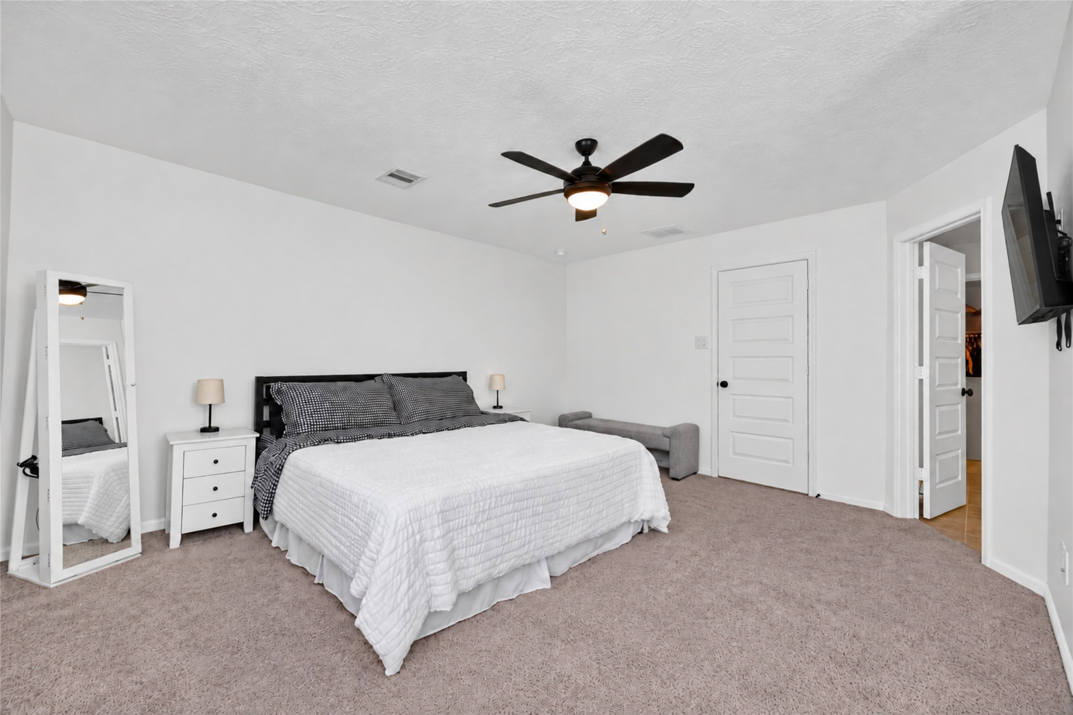 Create your ideal personal sanctuary in this inviting primary bedroom. The neutral finishes and generous floor space offer flexibility for your favorite furnishings and decorative style.