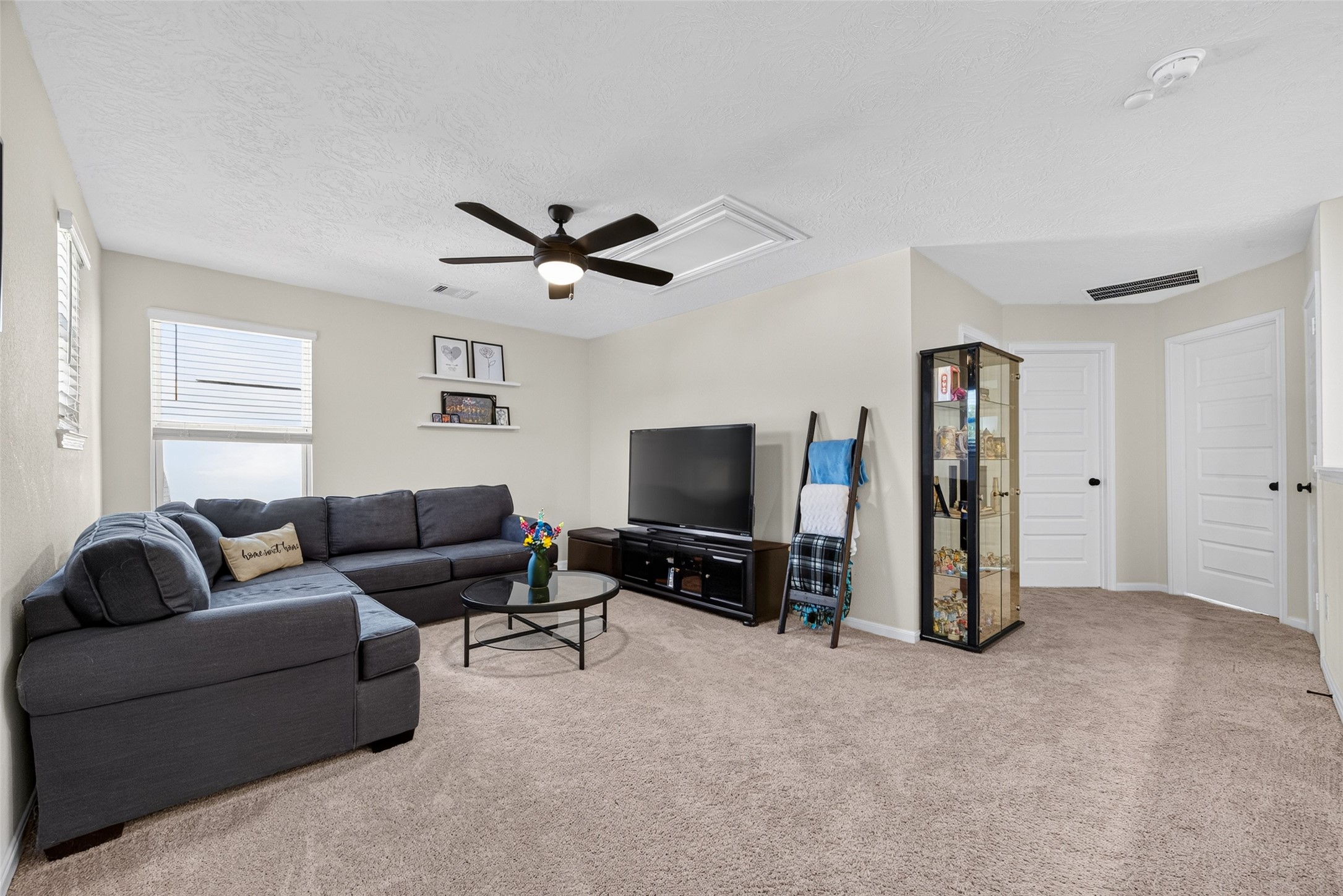 The spacious upstairs game room offers endless possibilities for recreation and relaxation. Imagine creating a media lounge, gaming retreat, or entertainment space tailored to your favorite activities.
