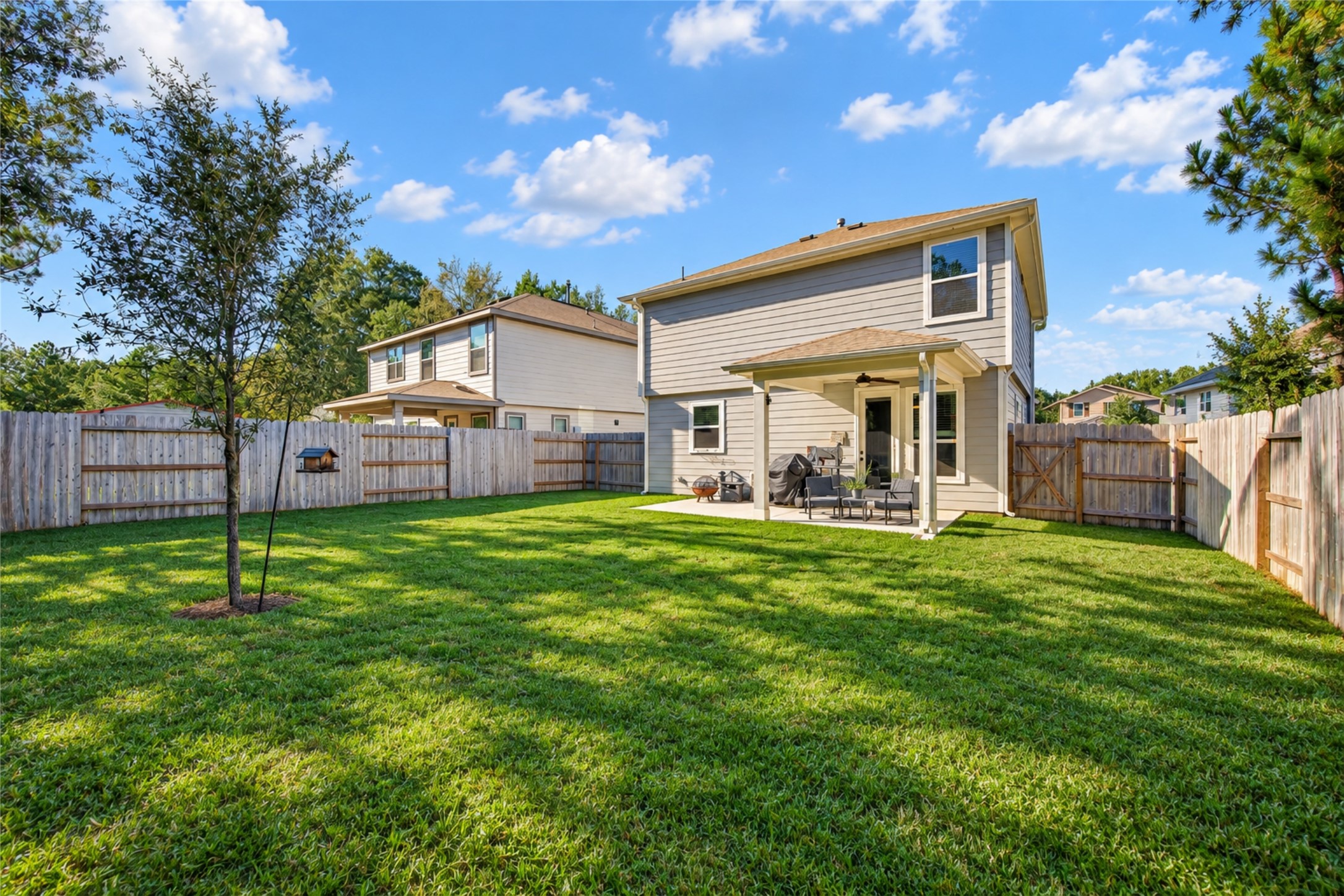 The open lawn provides flexibility for gardening, outdoor activities, or simply enjoying the fresh air.