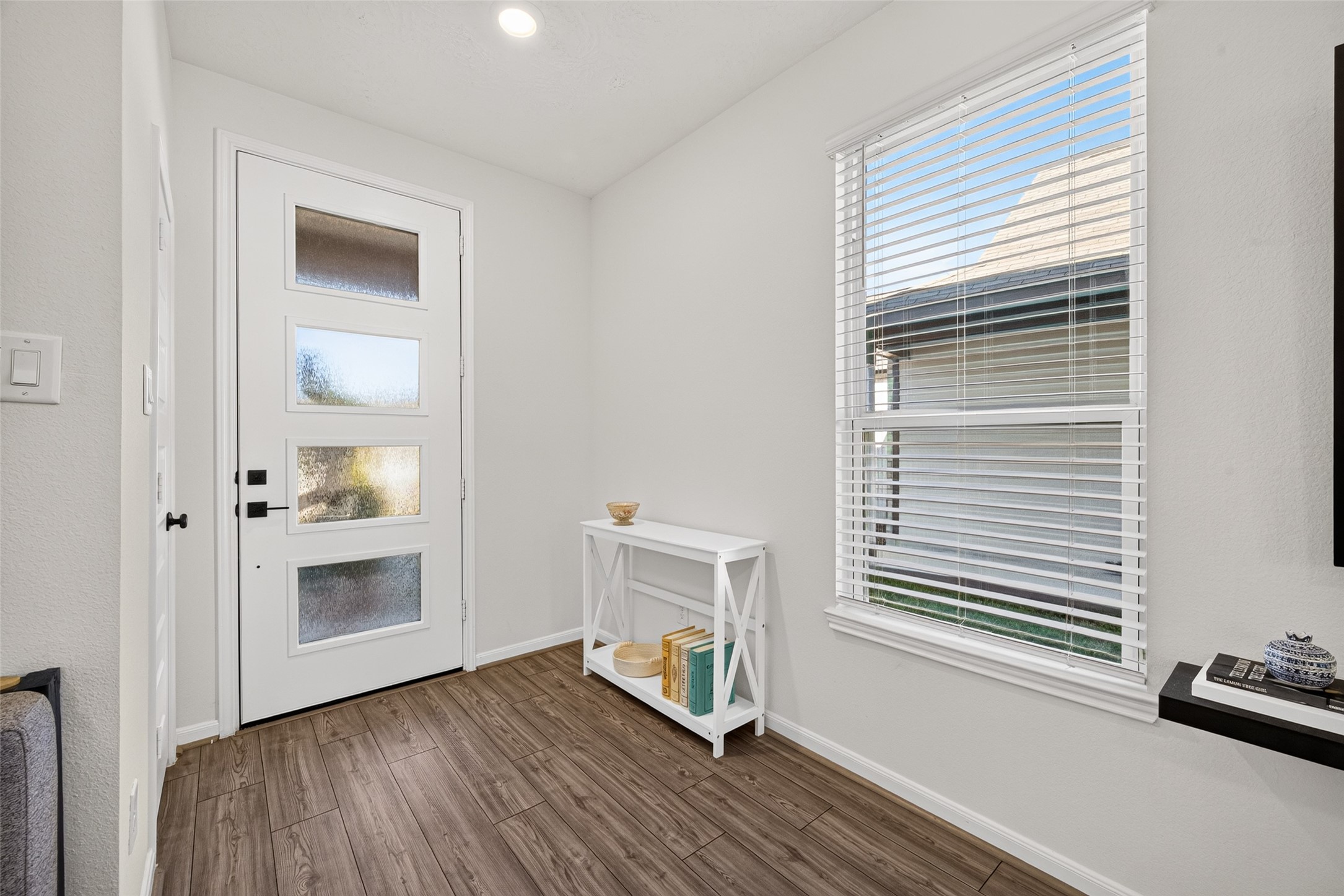 A bright entrance with natural light and attractive flooring offers a welcoming arrival. The convenient layout provides a pleasant transition into the home's open living spaces. A bright entrance with natural light and attractive flooring offers a welcoming arrival. The convenient layout provides a pleasant transition into the home's open living spaces.