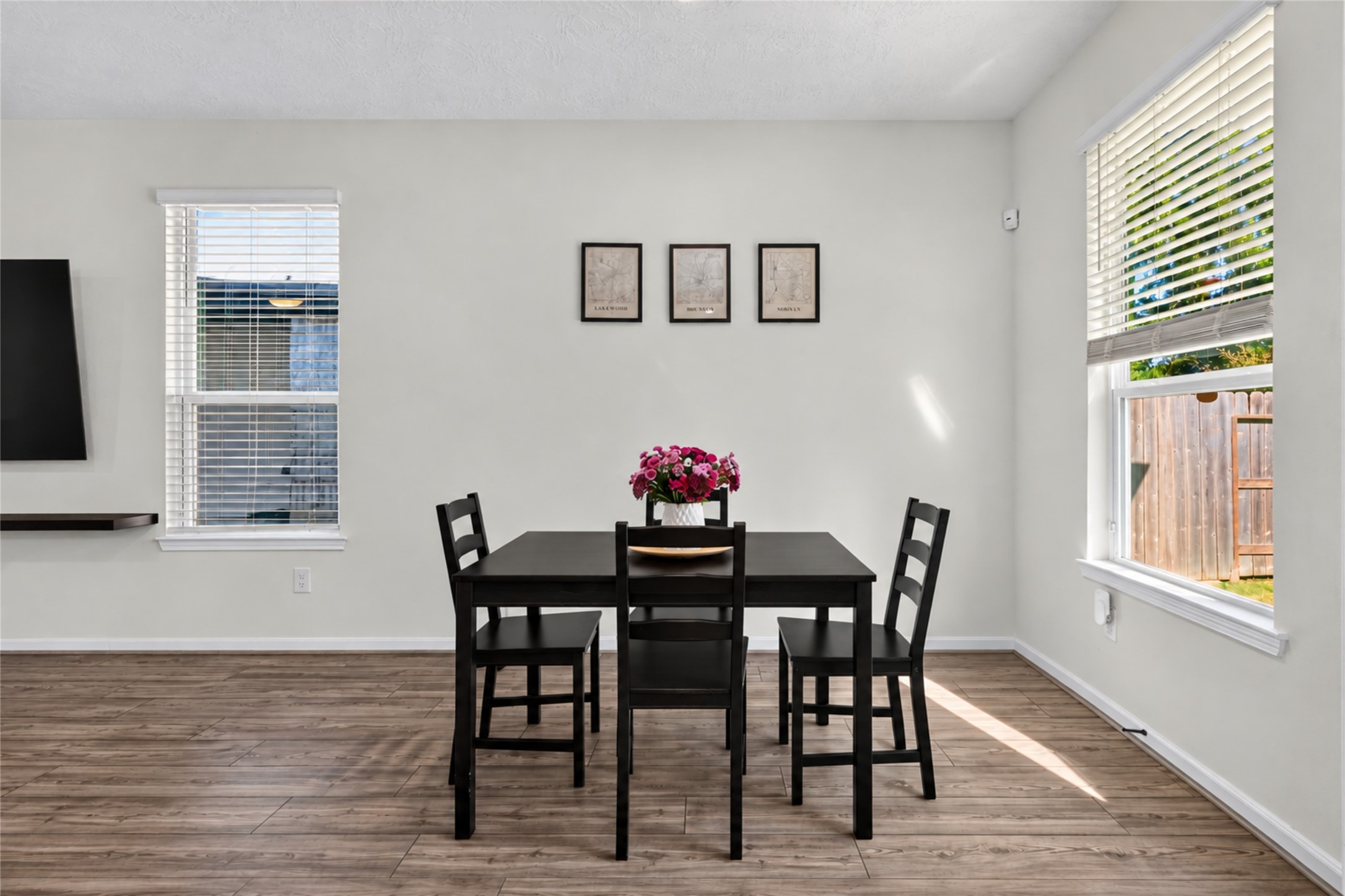 Start your morning with coffee and natural sunlight in this charming breakfast nook. Conveniently positioned near the kitchen, this inviting dining area is perfect for casual meals and relaxed conversations.