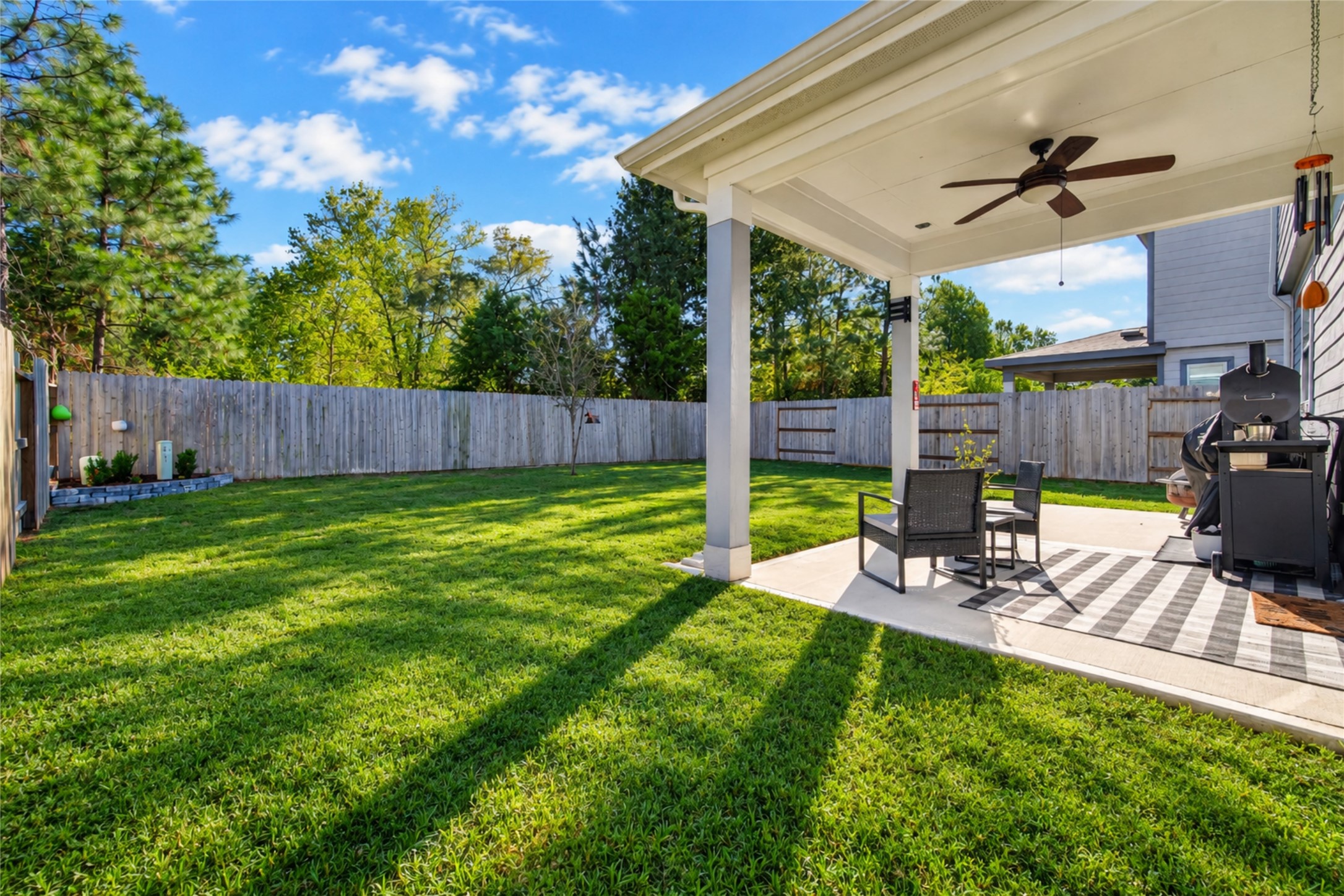 Enjoy the best of outdoor living with an extended covered patio overlooking the spacious fenced backyard. Whether dining outdoors, entertaining guests, or enjoying a peaceful afternoon, this space offers plenty of possibilities.