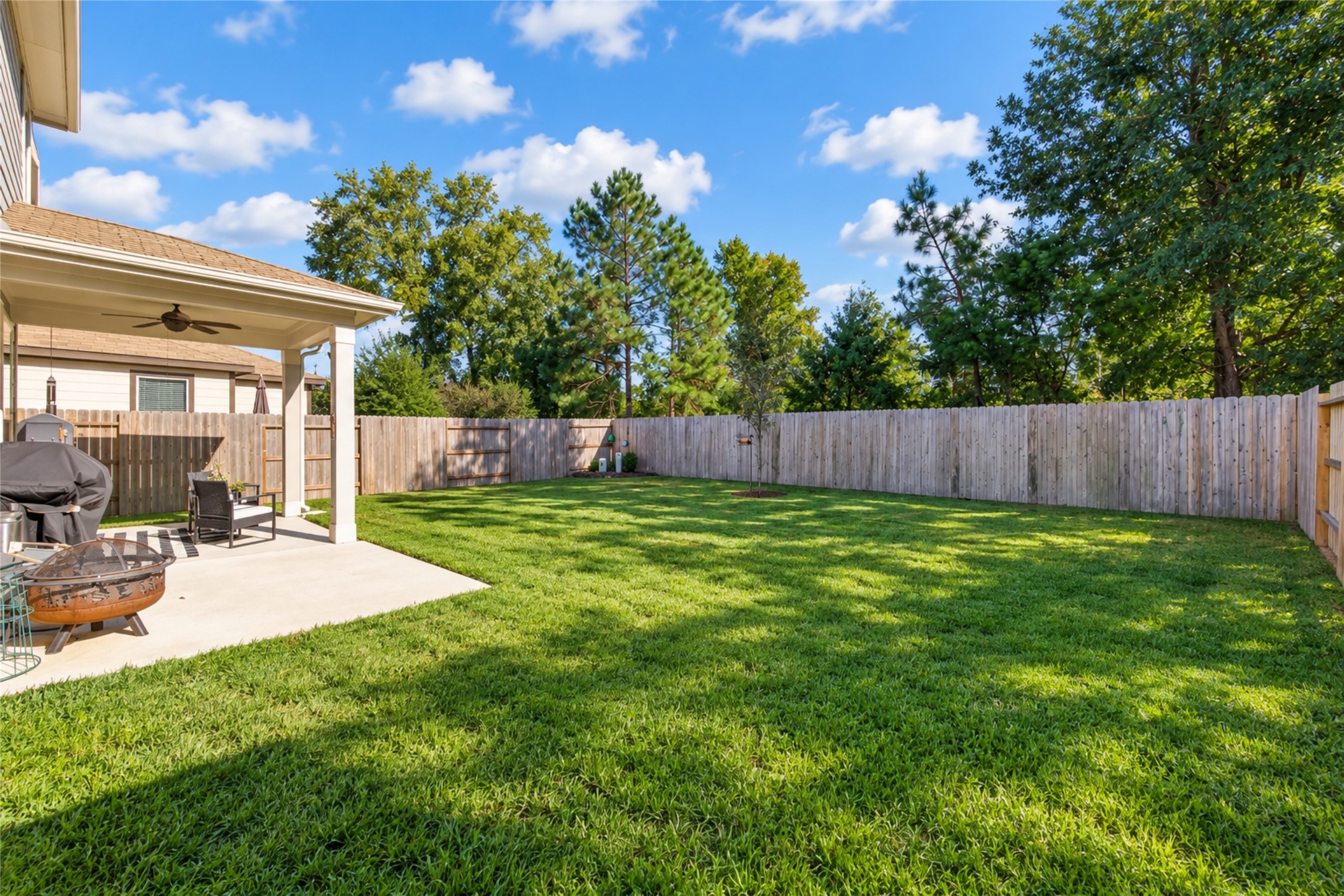 Discover the possibilities of this inviting outdoor space, featuring a covered patio and spacious fenced backyard.