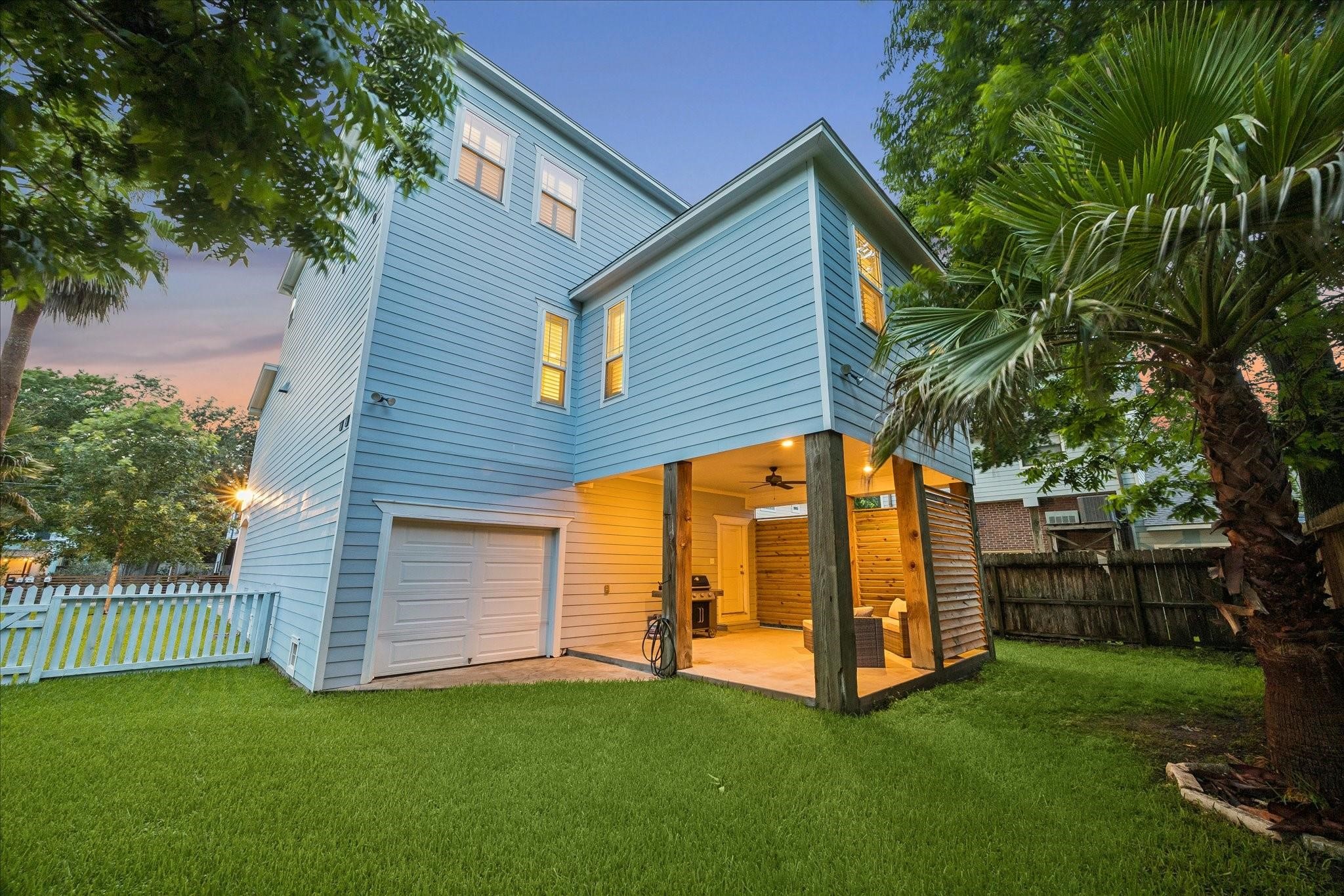 Complete with a white picket fence, garage access and mature trees for added privacy and shade