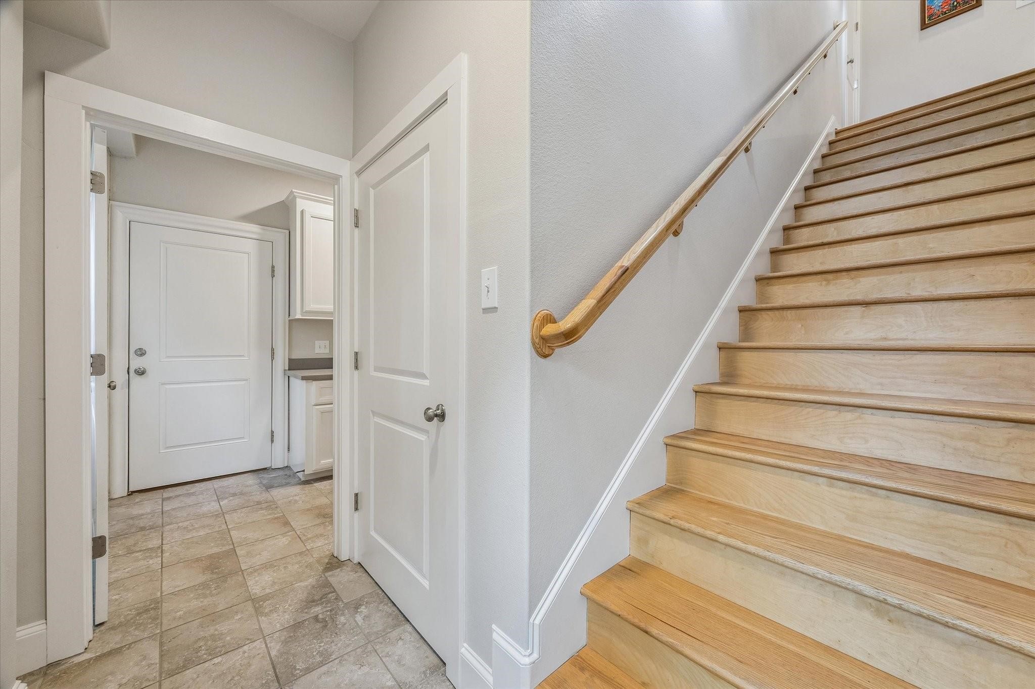 Private entry from the garage with the stairs leading to the main level. An expansive laundry/mud room, storage closet and access to the backyard