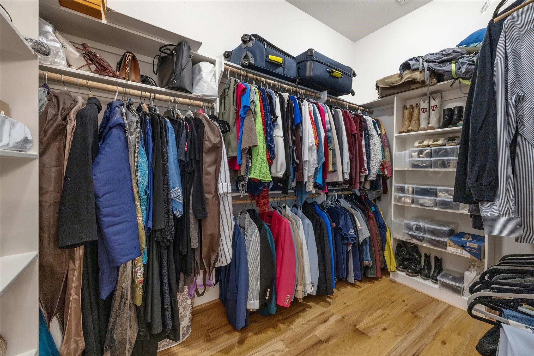 Walk-in closet with custom storage in a neat and organized layout