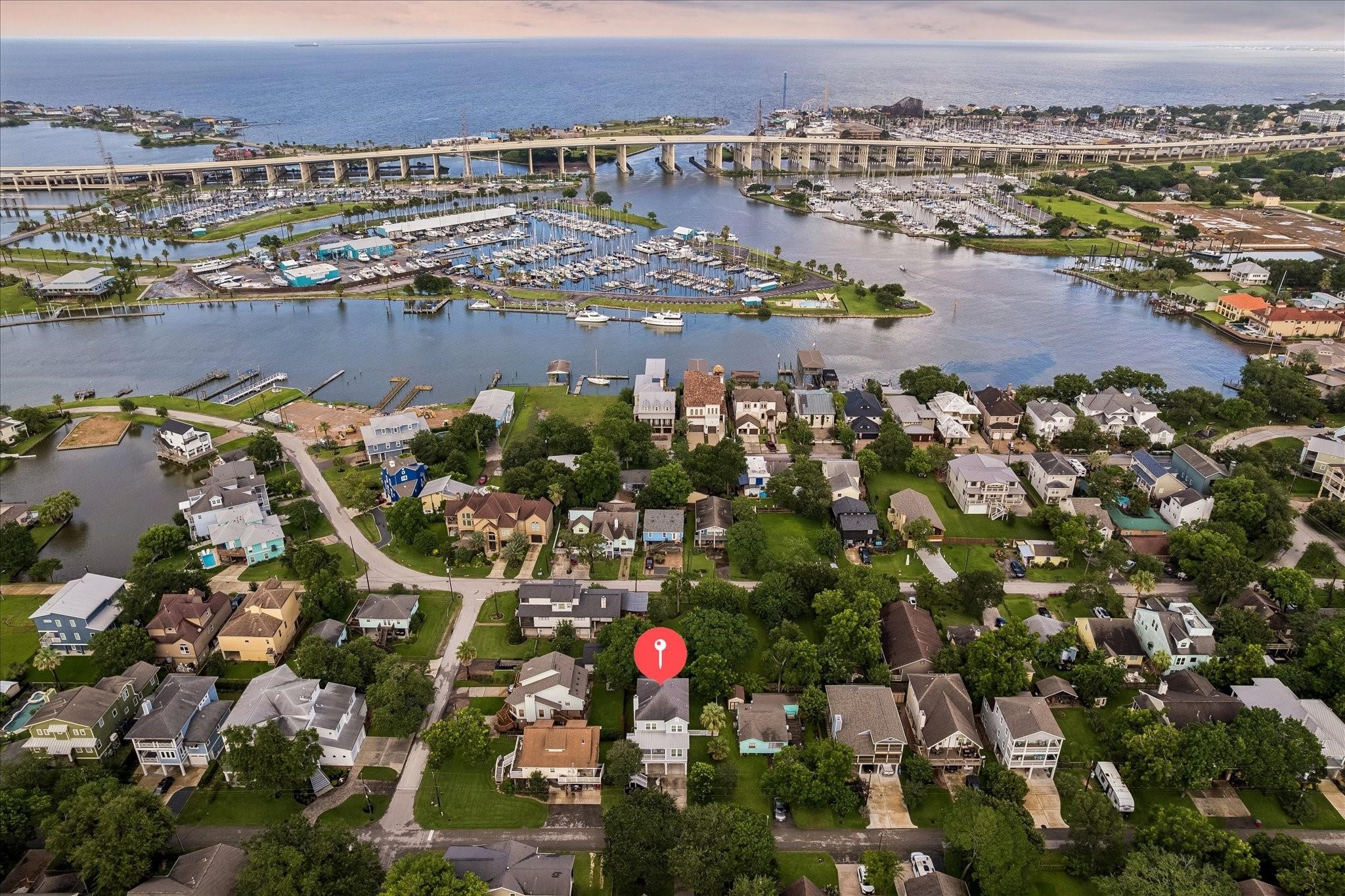 Aerial view showcasing the homes proximity to Galveston Bay and easy access to HWY 146