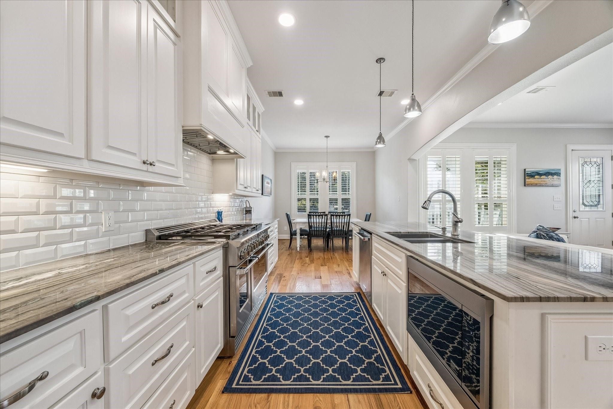 Plenty of storage and countertop space, under cabinet lighting, microwave drawer and large stainless sink