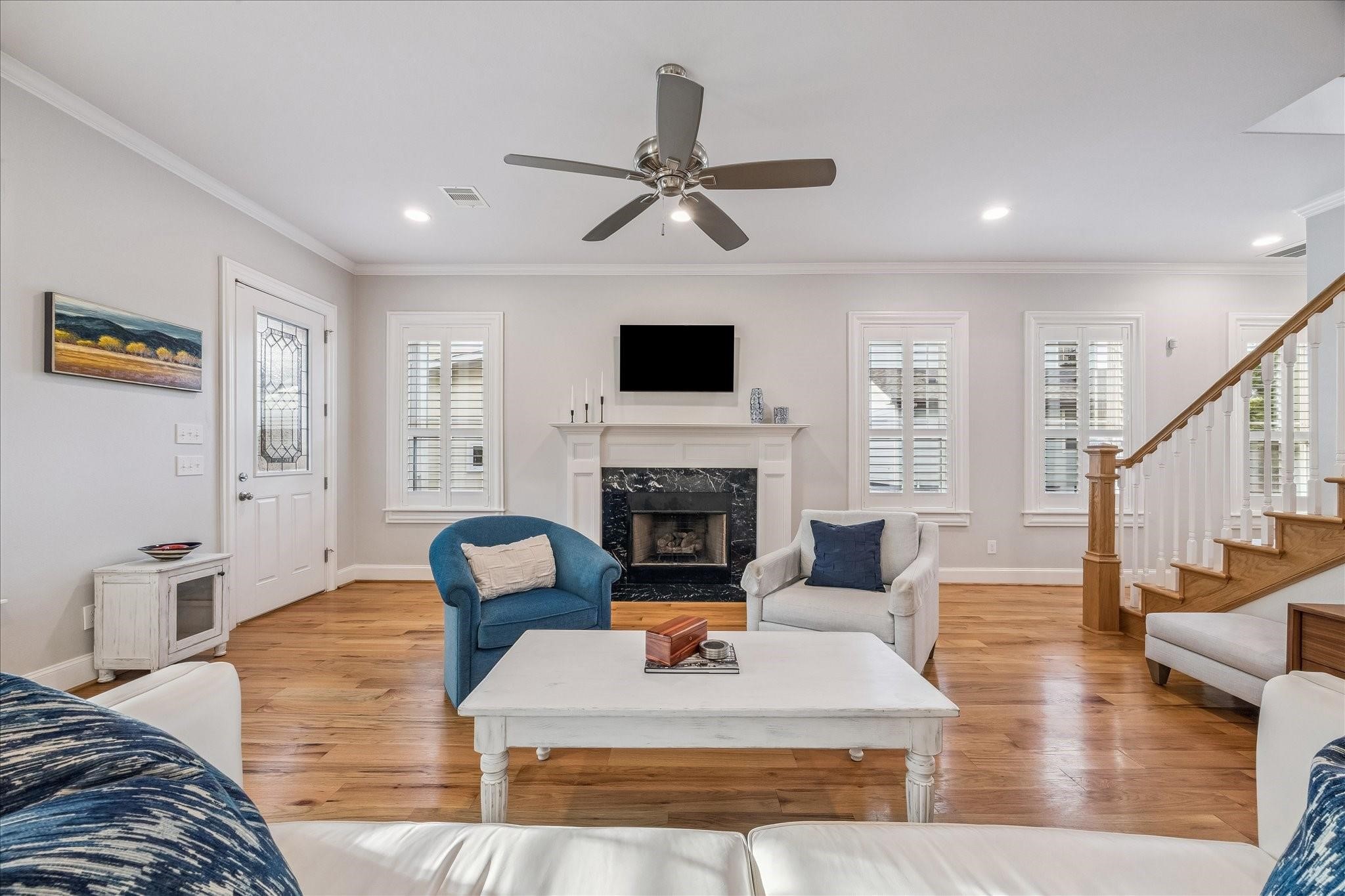 Your choice of gas or wood burning fireplace to cozy up to with tile surround, custom mantle and wall mount TV ready