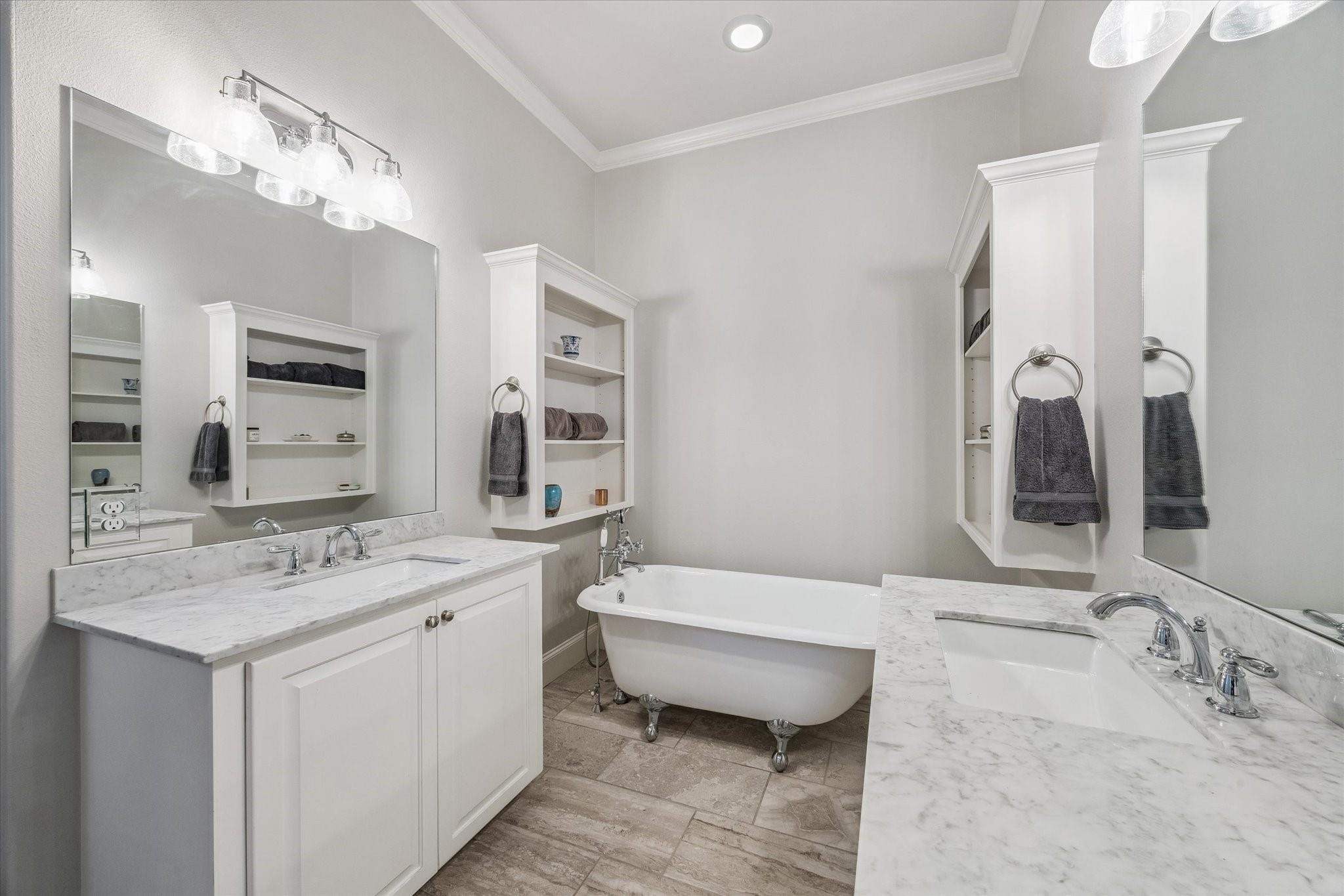The neutral color palette and modern fixtures create a serene, spa-like atmosphere.
