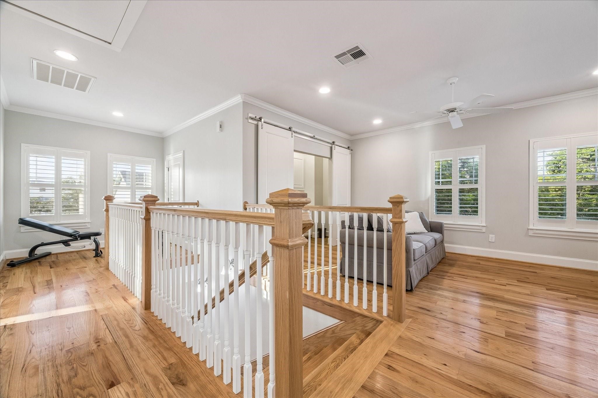 Full view of the upstairs landing layout. Game room, office, flex area and huge storage closet with easy access to adjacent bedrooms