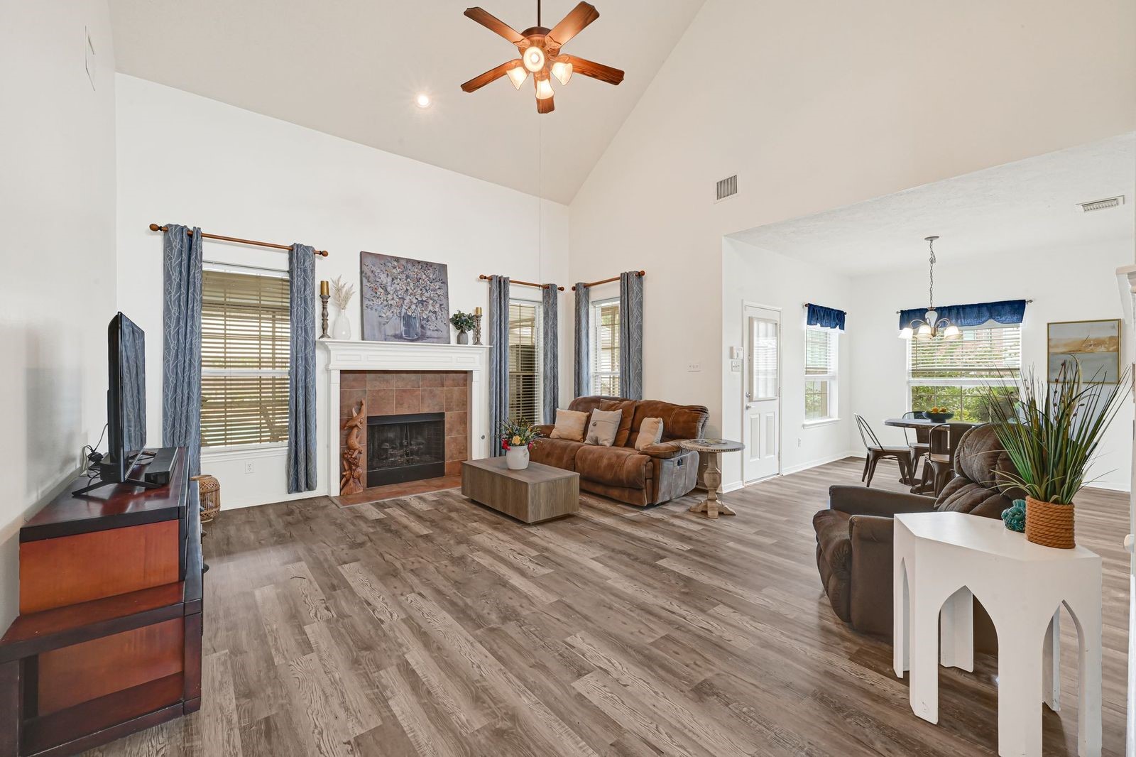 Open living area with vaulted ceilings to the second story