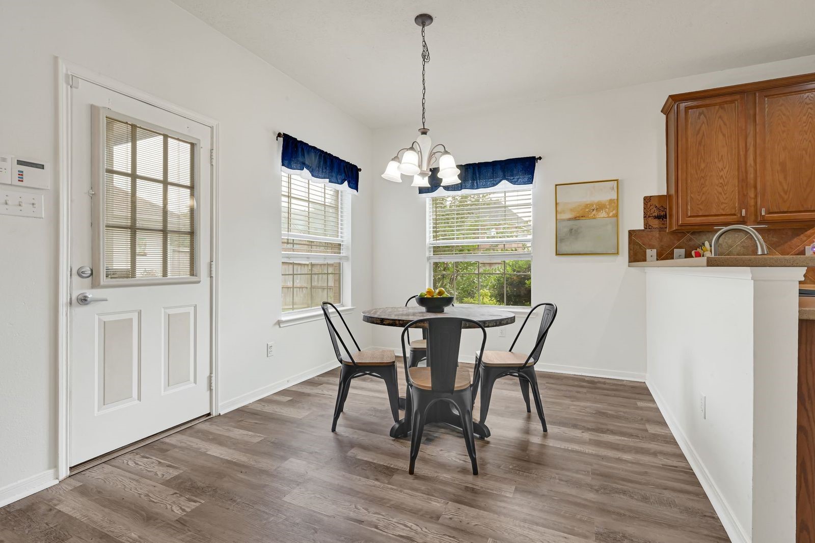 Breakfast nook open to kitchen and living room