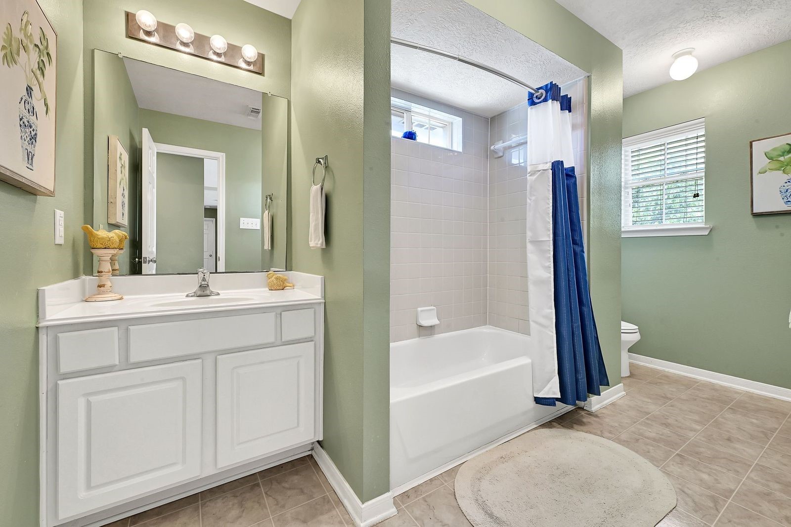 Roomy Bathroom with a shower tub combo next to bedroom 4