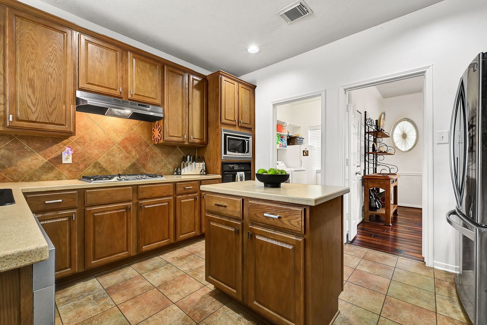 Oversized island kitchen with lots of cabinets
