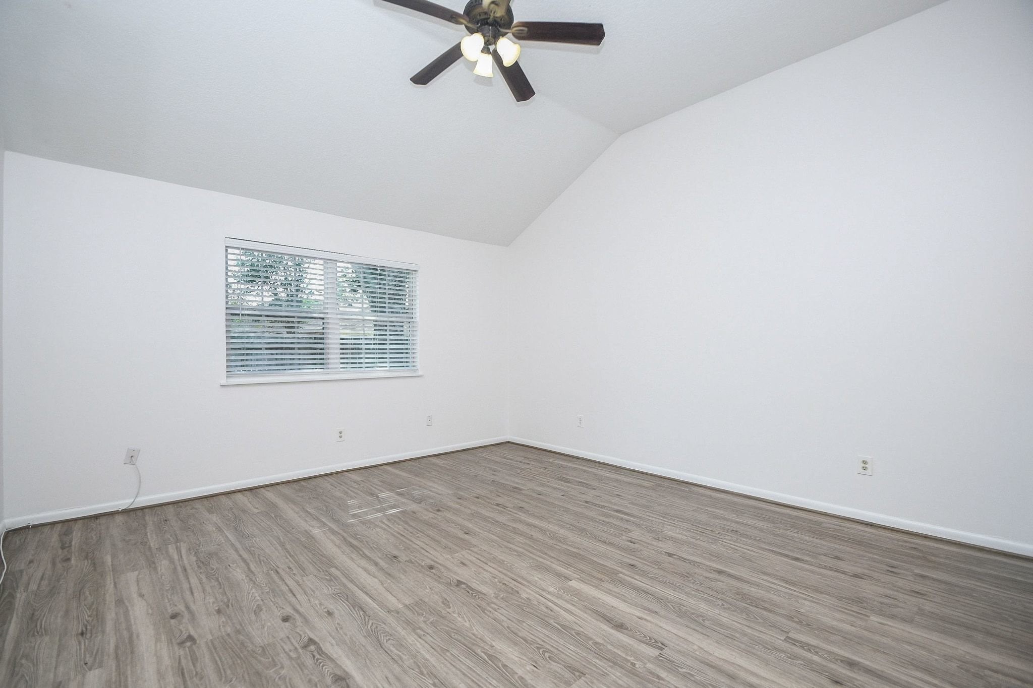 The primary bedroom also has high ceilings.