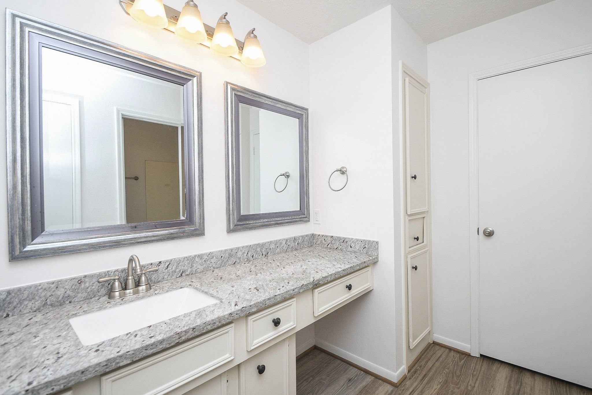 Second bathroom with vanity seating.