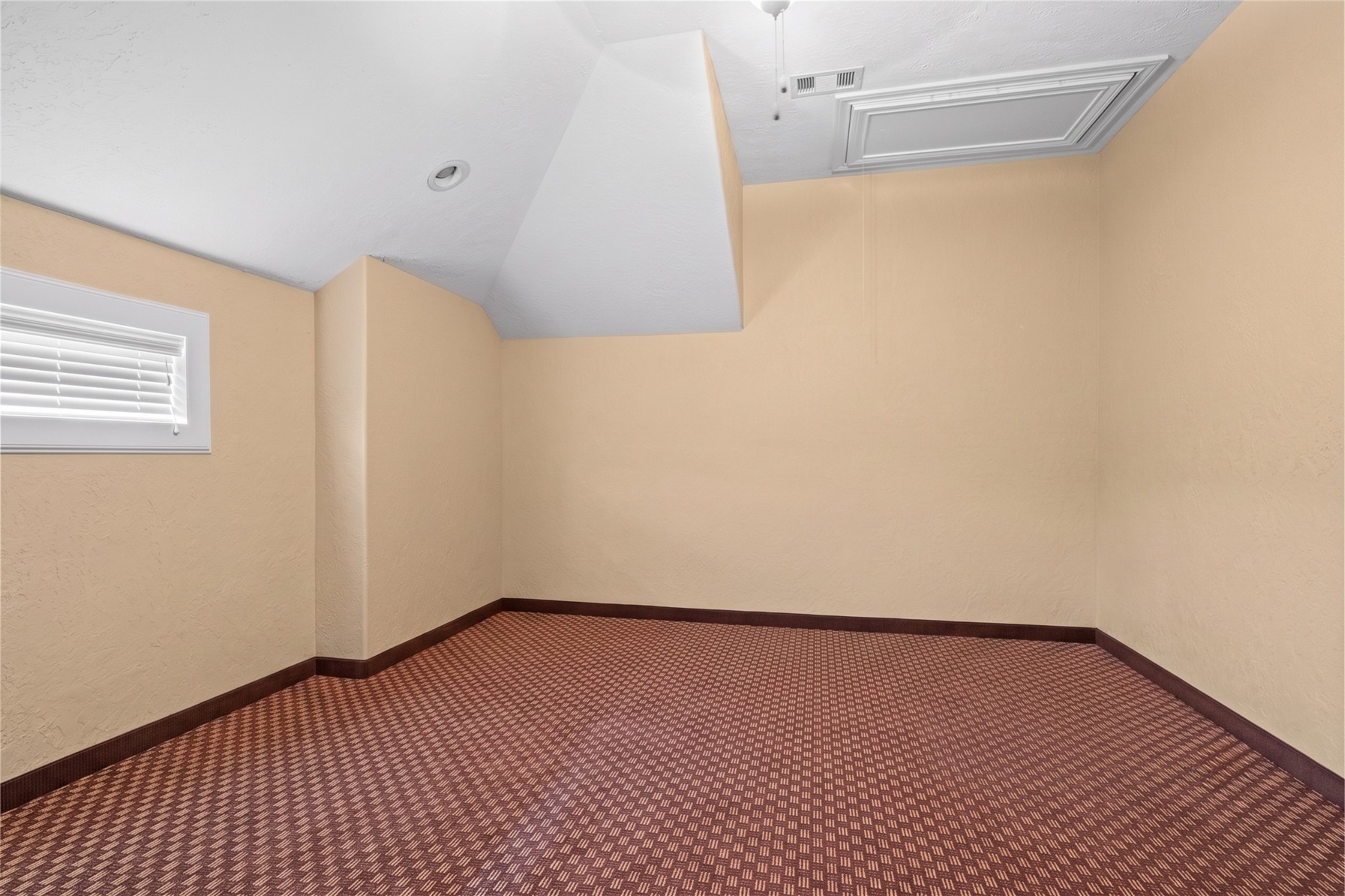 Versatile bonus room offering generous space and flexibility for recreation, hobbies, or additional storage.