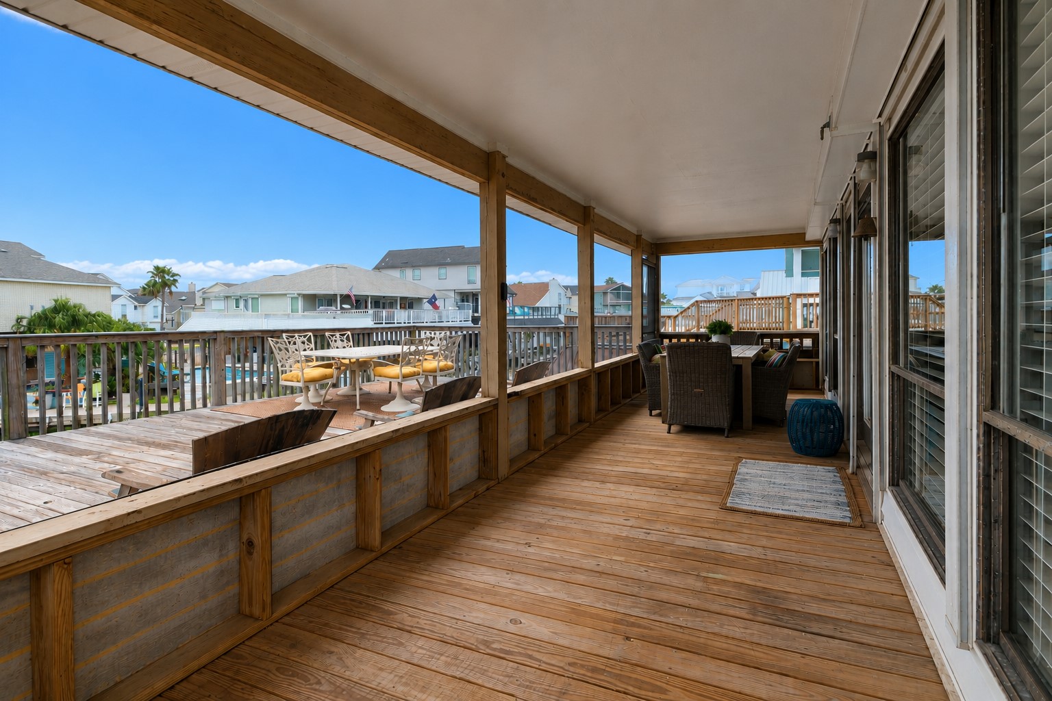 The entry to the home brings the inside out with a covered area to dine alfresco. The entry to the home brings the inside out with a covered area to dine alfresco.