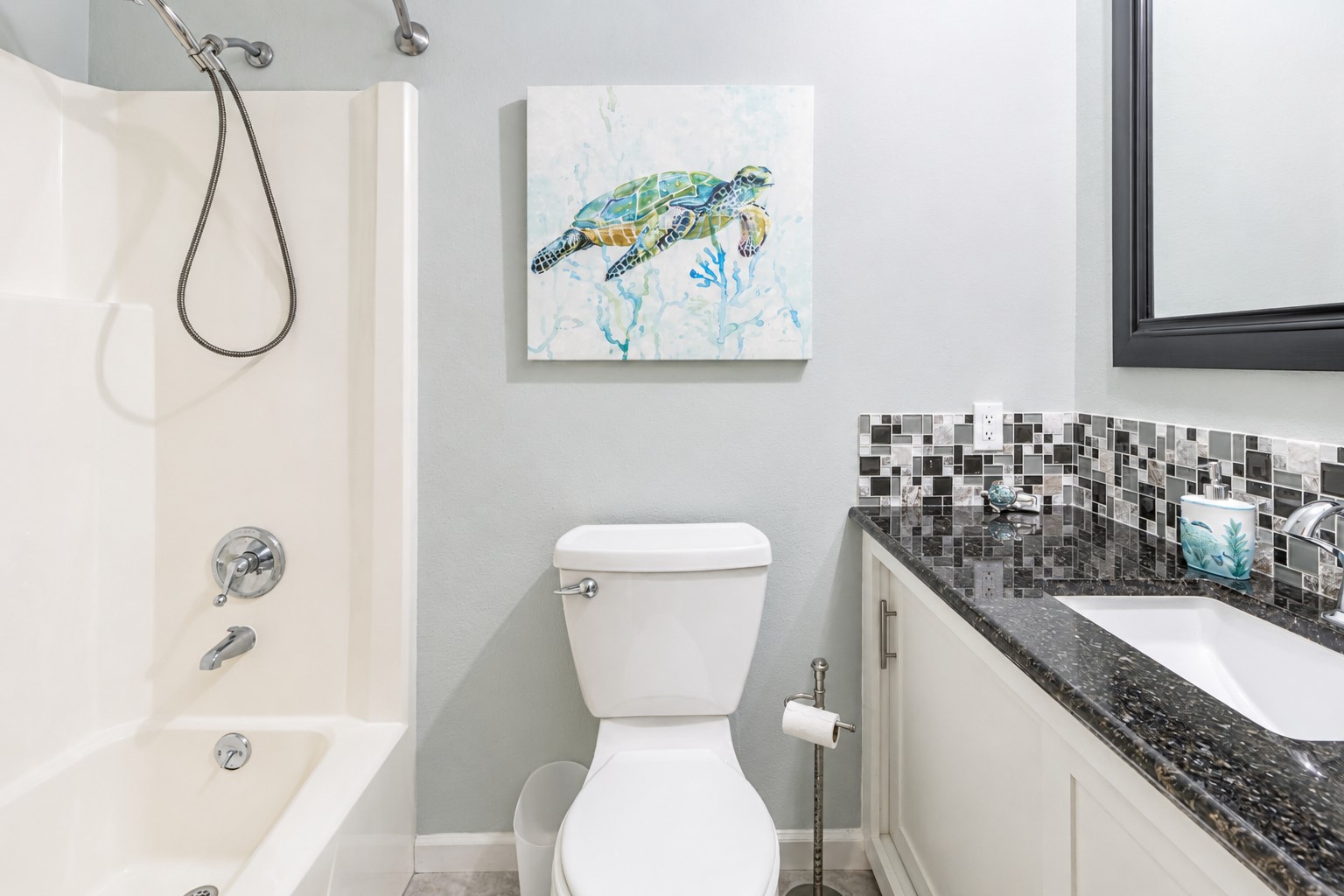 Main bath is centrally located for guests and secondary bedrooms.