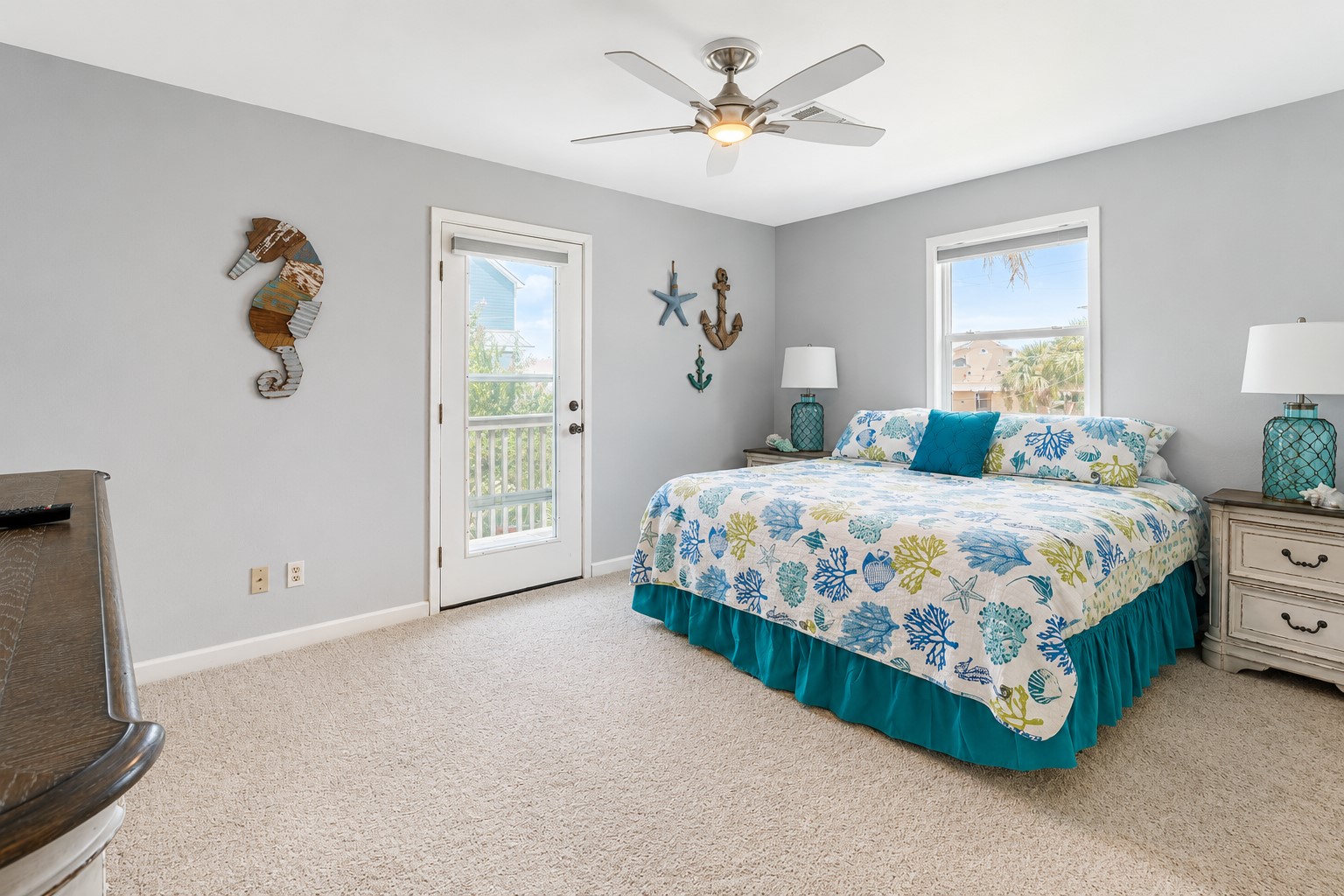 Primary bedroom leads to a private balcony.