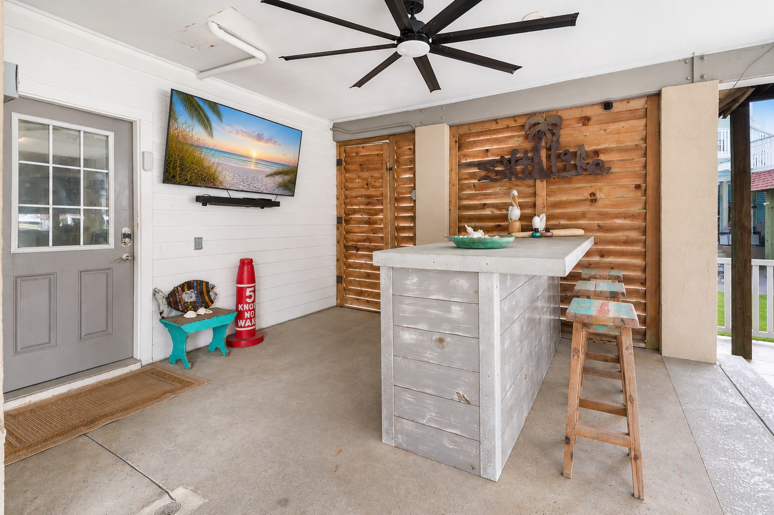 Bar area and back door entry to the enclosed garage.