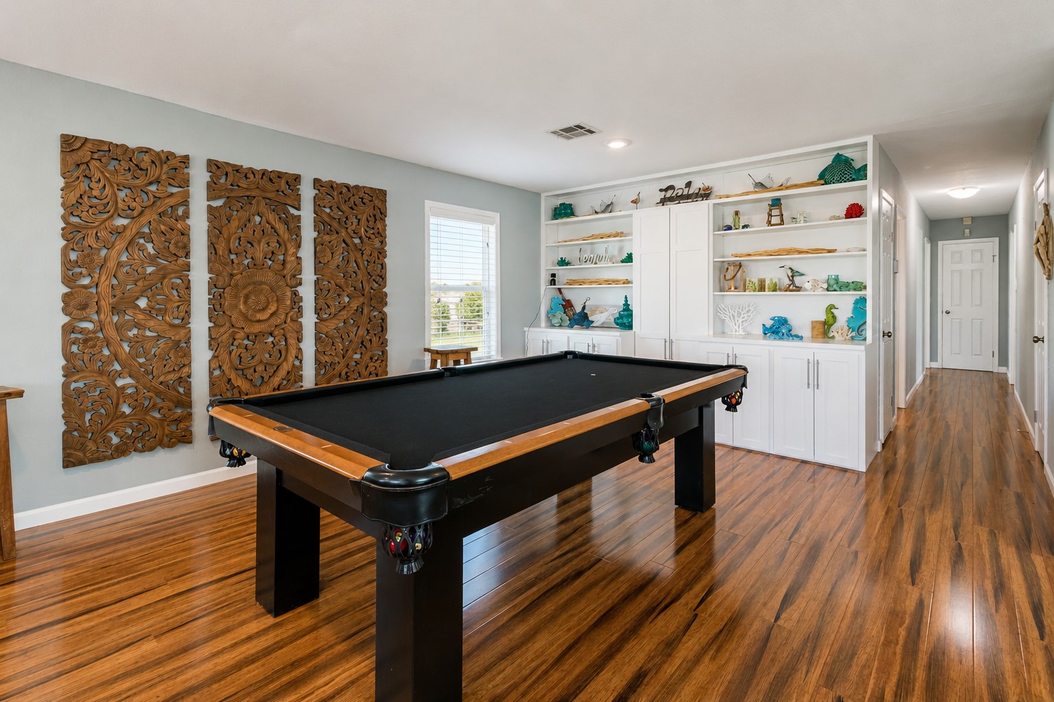 The additional area of the living space gives ample room for a friendly game of pool.