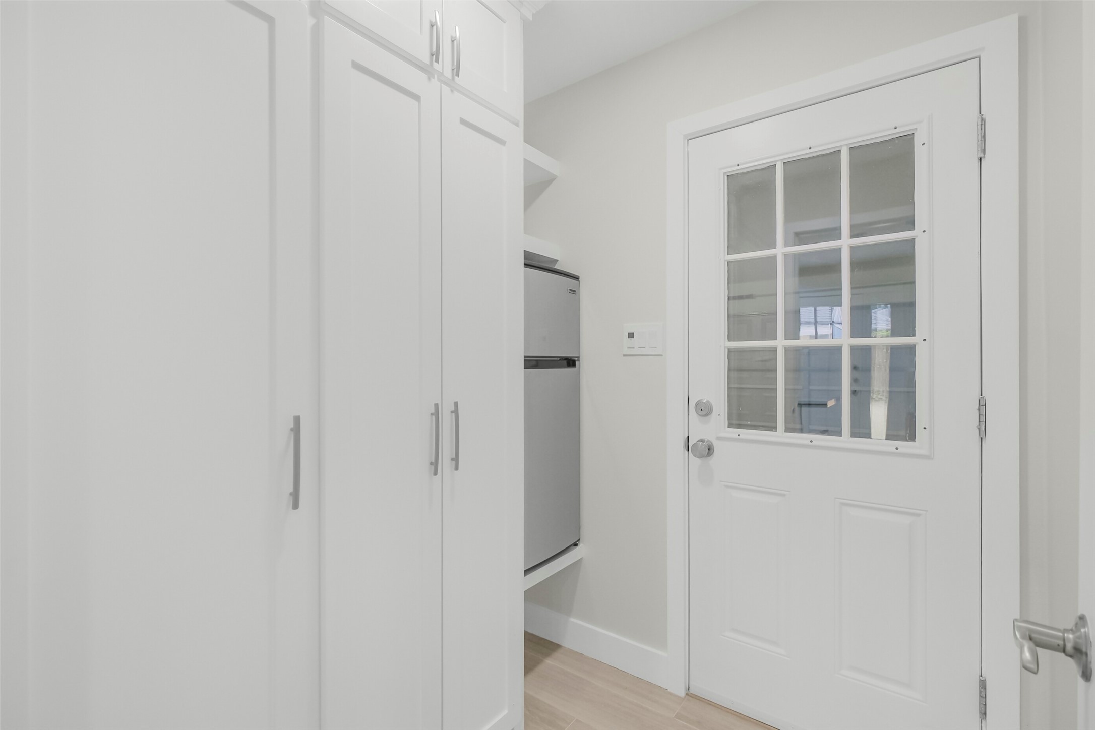 Mudroom entry from the garage. Great for additional storage, kids sporting goods and secondary refrigerator space.