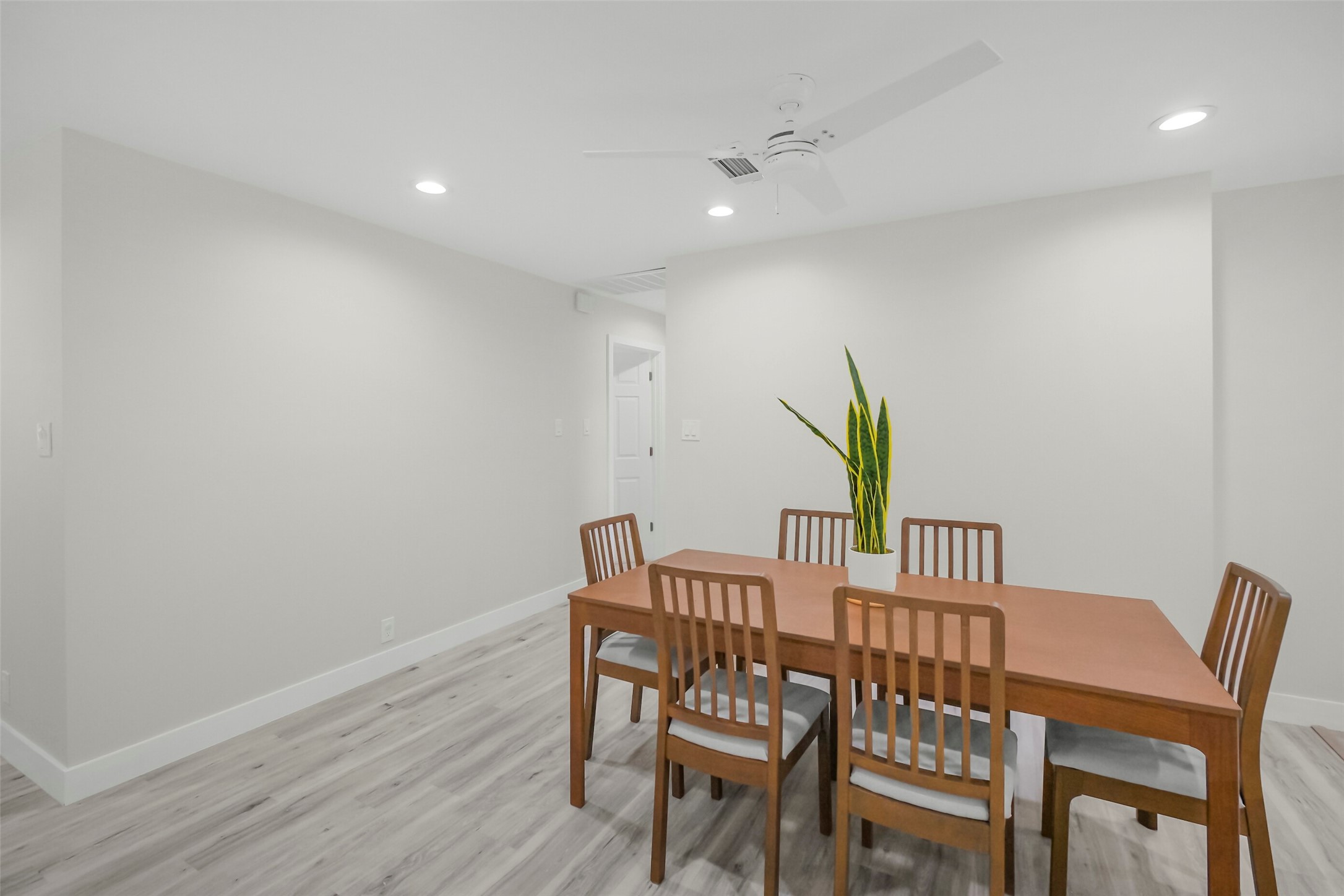 Secondary view of the dining room. Hallway leads to both bedrooms.