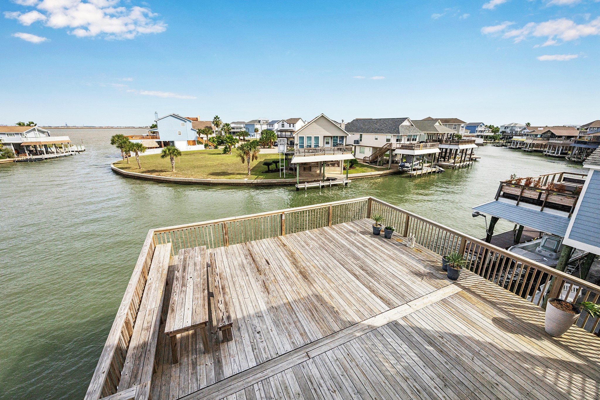 Enjoy serene bay views from this expansive deck, perfect for relaxing or entertaining in a picturesque waterfront setting.