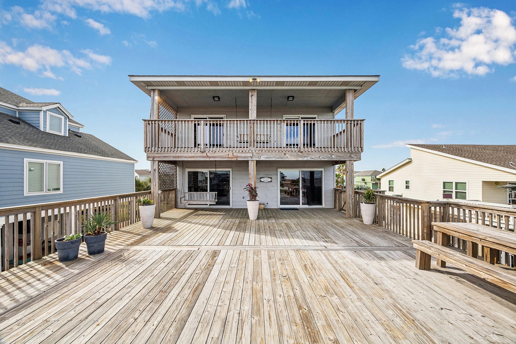 Explore the perfect blend of relaxation and entertainment with this home's expansive, sunlit deck and charming upper balcony, ideal for enjoying serene views and hosting memorable gatherings.