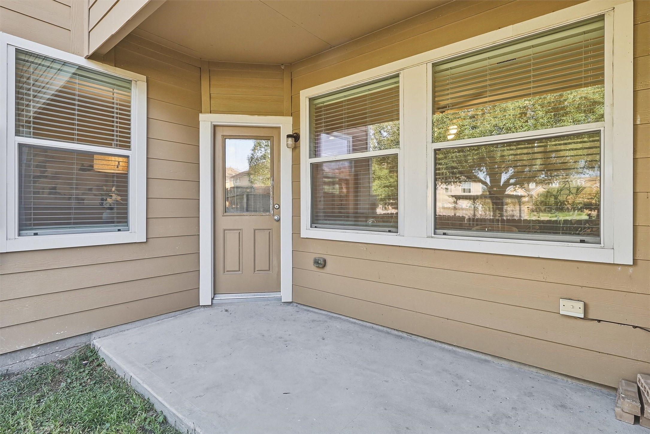Enjoy the outdoors on your covered patio!  There's space for your grill and a small dining set.