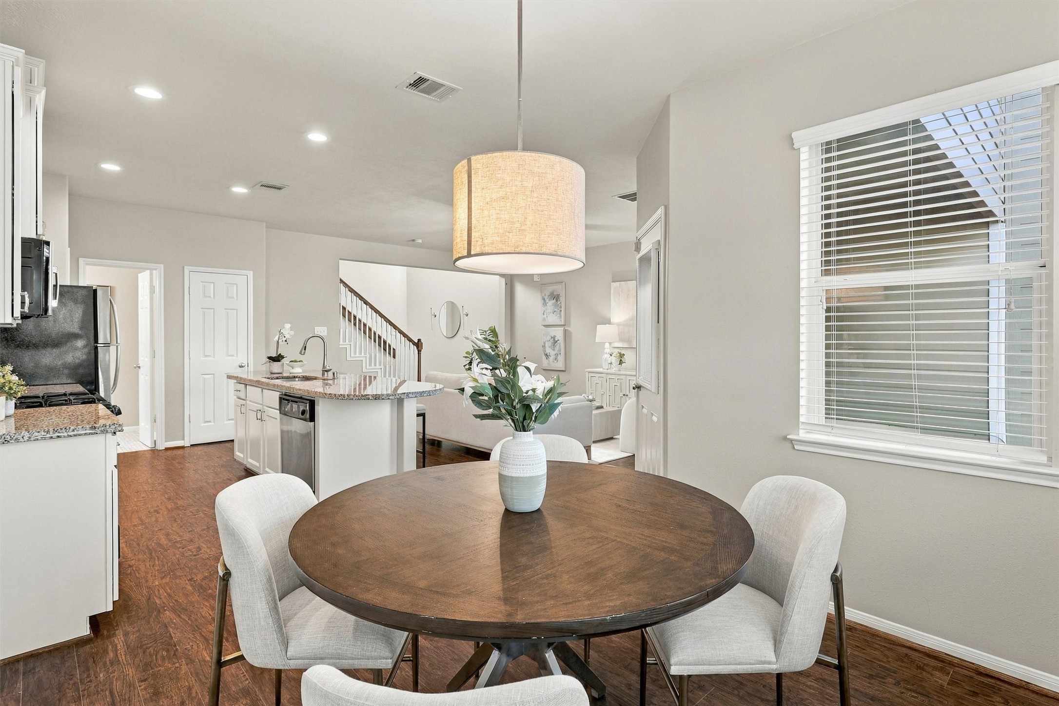 Alternate view of the dining room shows off the open concept floor plan. You will love living here!