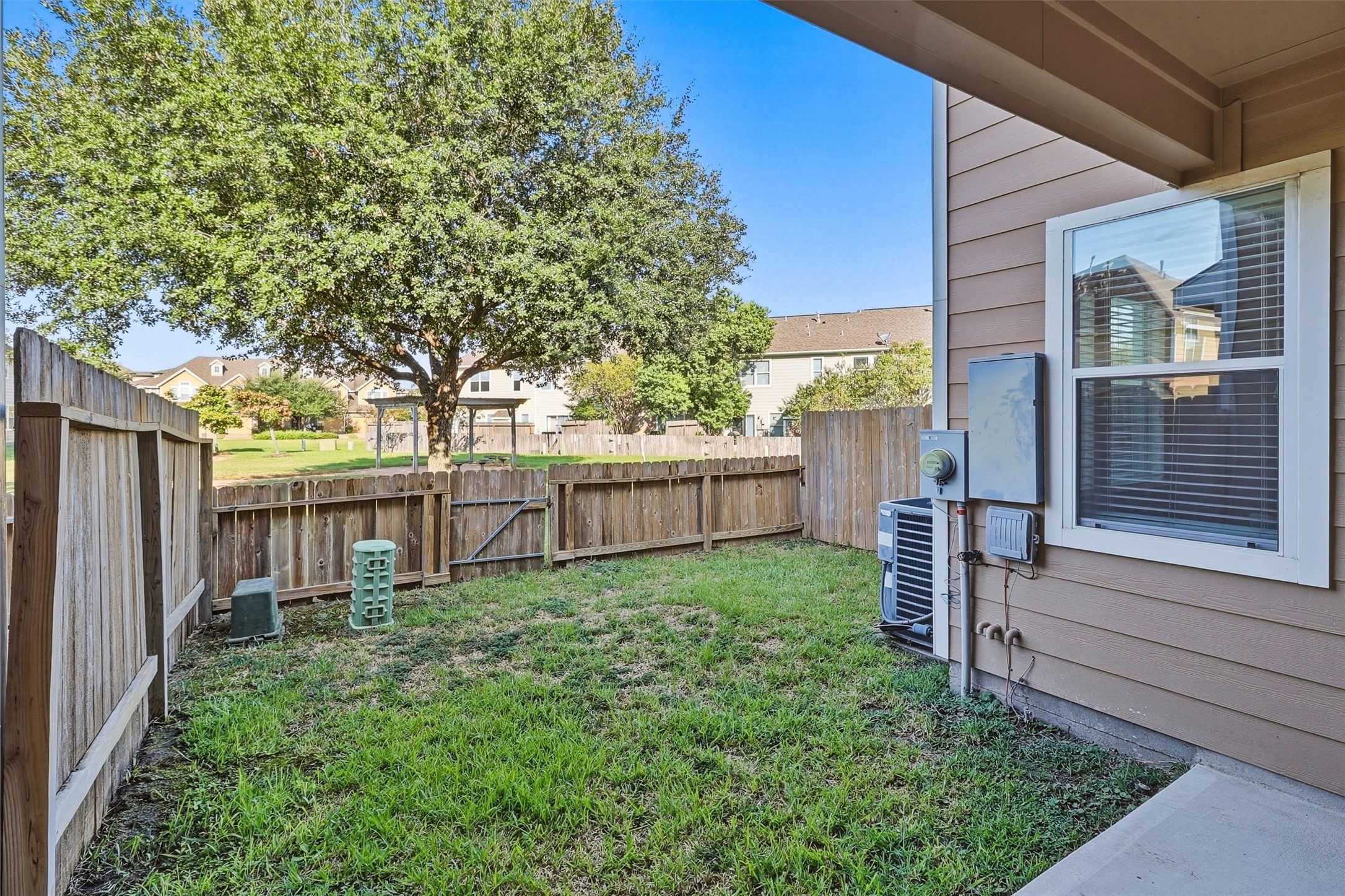 The private yard features an updated fence and sprinkler system maintained by the HOA.  No need to worrry about exterior paint either!
