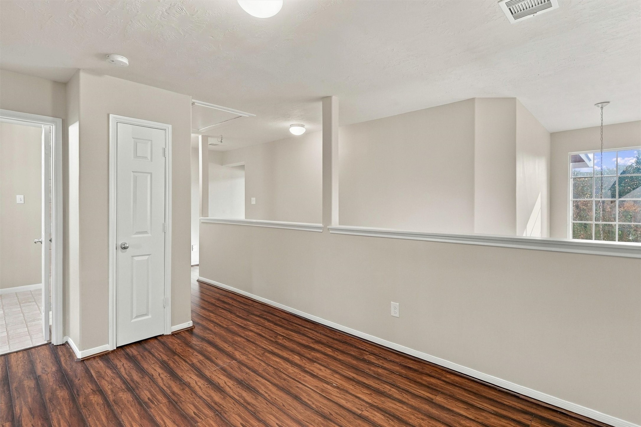 Travel outside the primary suite to find your game room at the top of the stairs!  This space is perfect for play or setting up a home office.  A convenient storage closet is located at the back of the room.