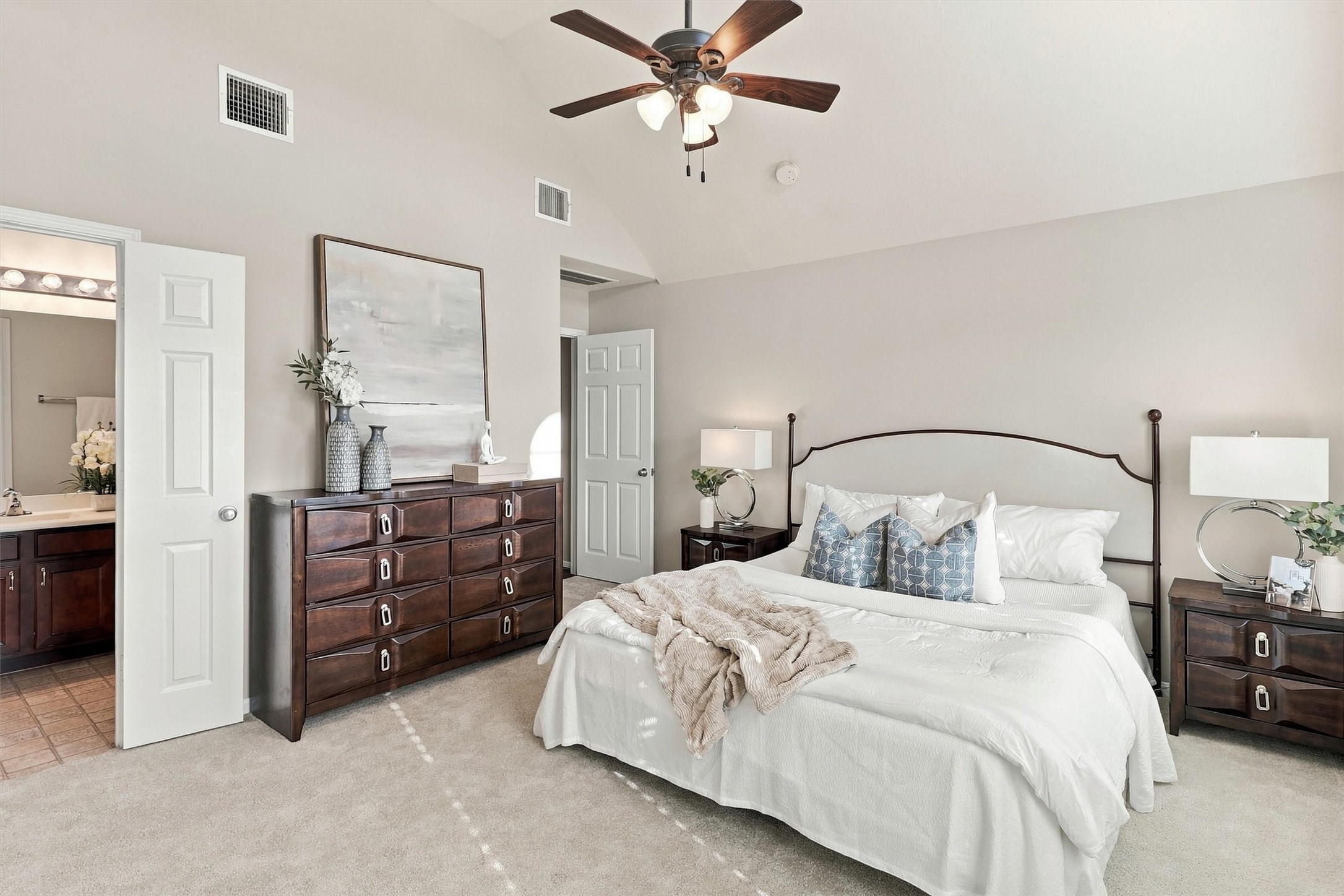 This view of the primary suite shows how spacious it is.  Double doors open to your en suite primary bathroom.