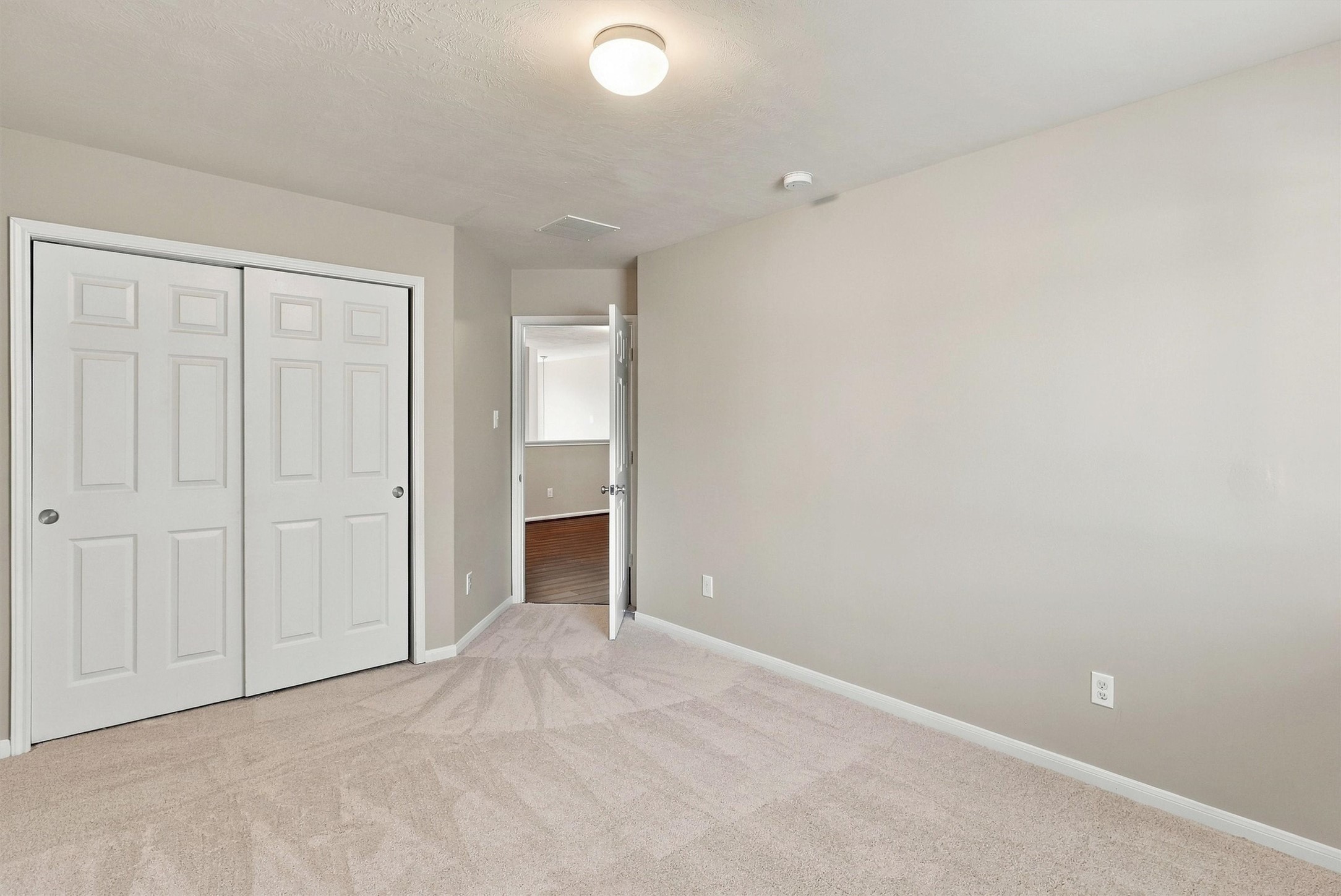 At nearly 13x10, there's plenty of space for a queen size furniture suite.  Sliding closet doors offer plenty of space for your clothes and accessories.